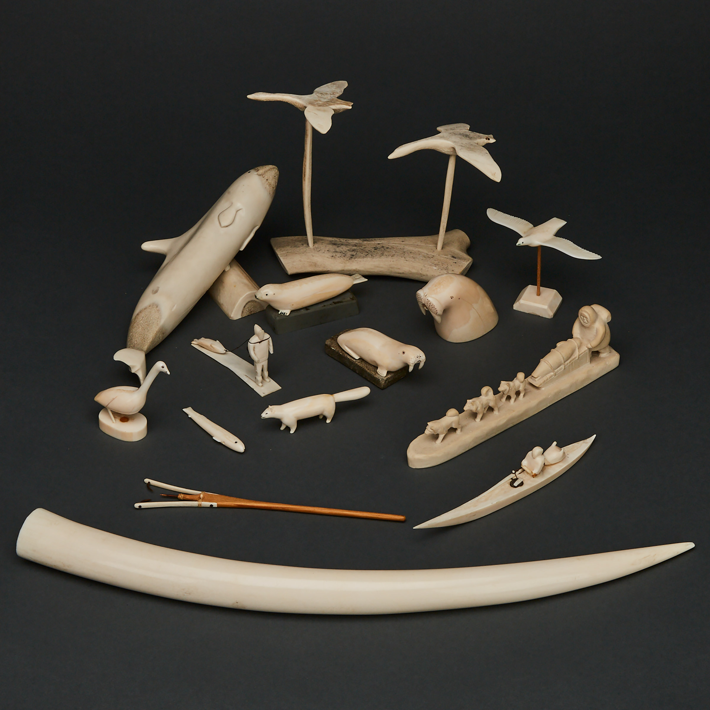 A COLLECTION OF BONE AND IVORY CARVED FIGURES