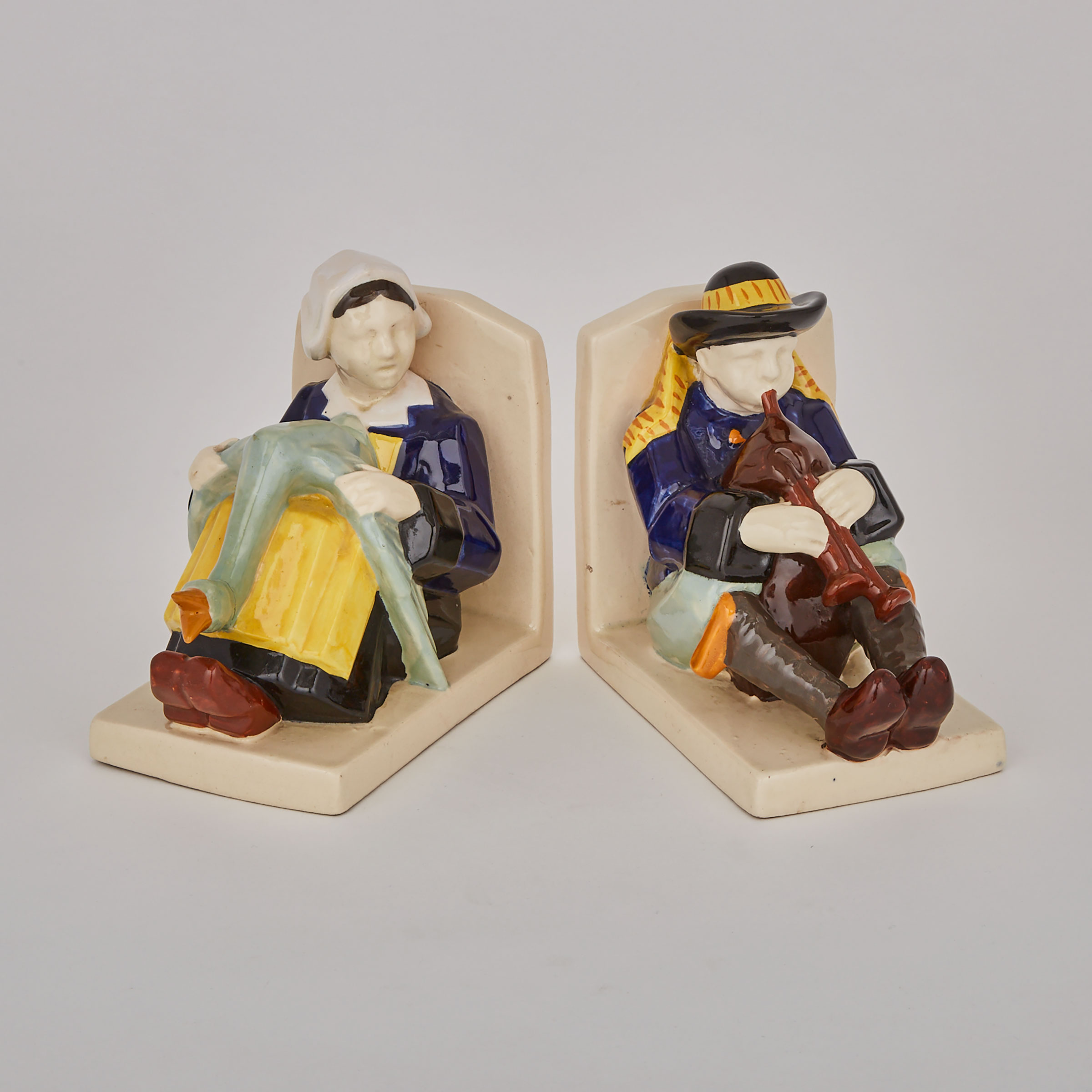 Pair of Quimper Bookends, Two Berthe Savigny Figures and Two Miniature Jim Eugène Sevellec Figure Groups, early 20th century