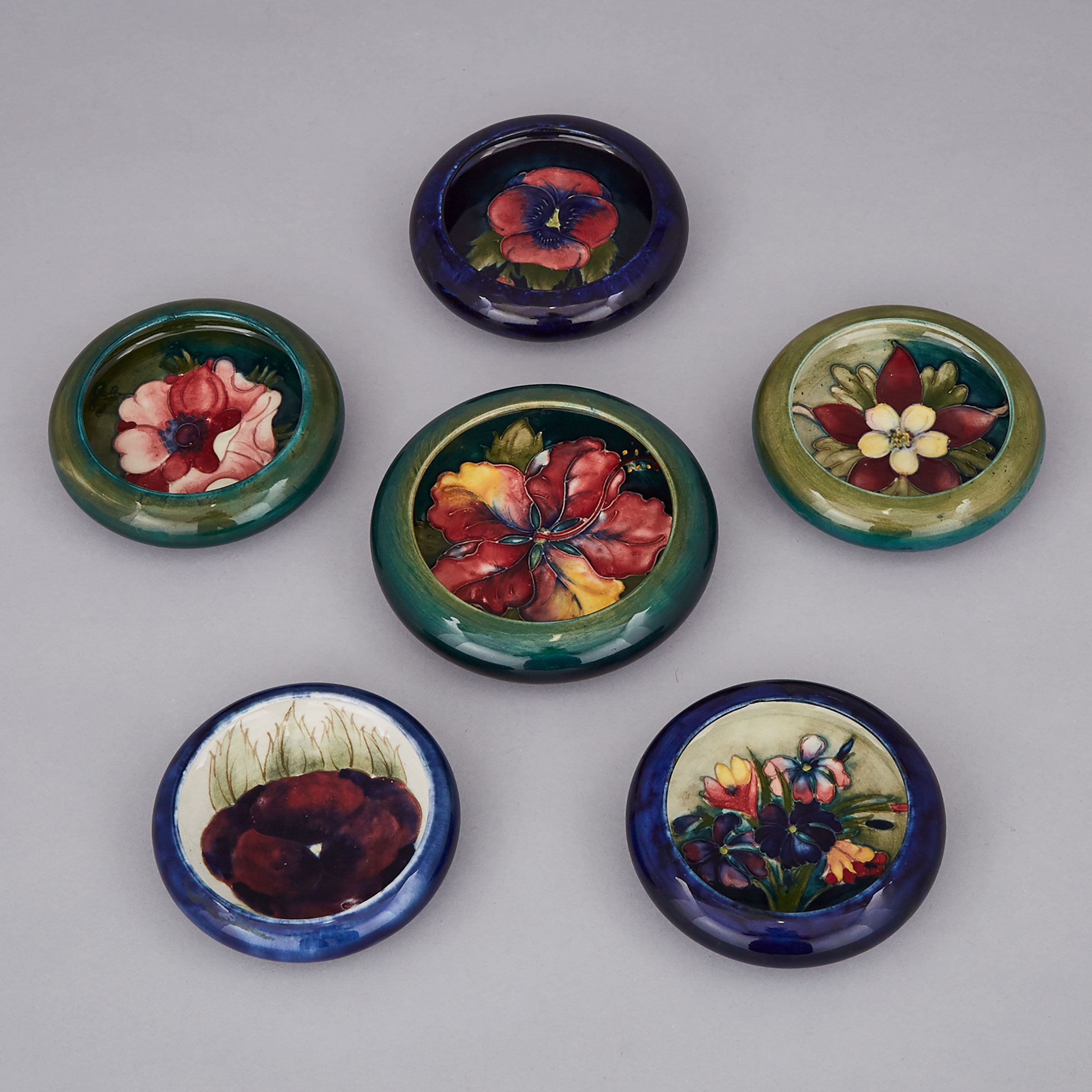 Six Moorcroft Floral Ashtrays, 20th century