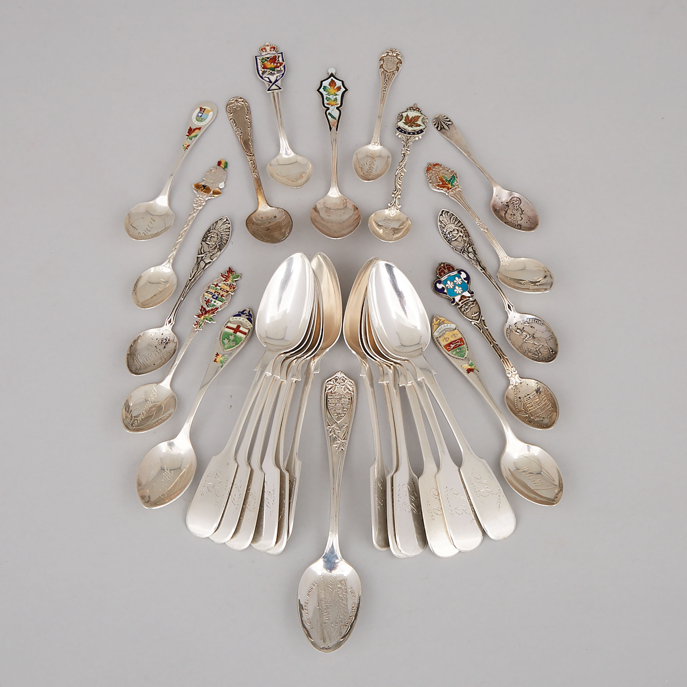 Twelve Canadian Silver Fiddle Pattern Tea Spoons, Hendery & Leslie, Montreal, Que. for Canada Mfg. Co., and Sixteen Souvenir Spoons, late 19th/20th century