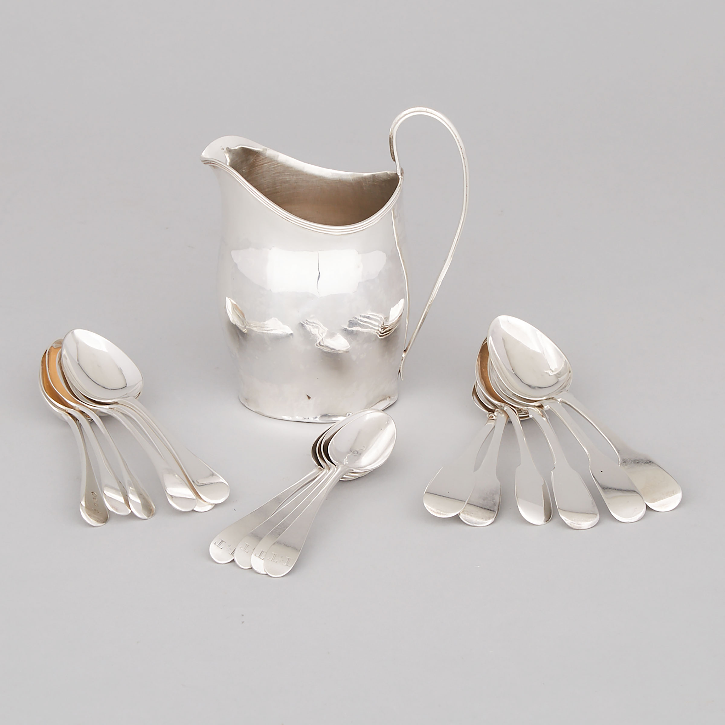 George III Silver Cream Jug and Sixteen Tea Spoons, makers including Hester Bateman and Peter & Ann Bateman, London and York, late 18th/19th century 