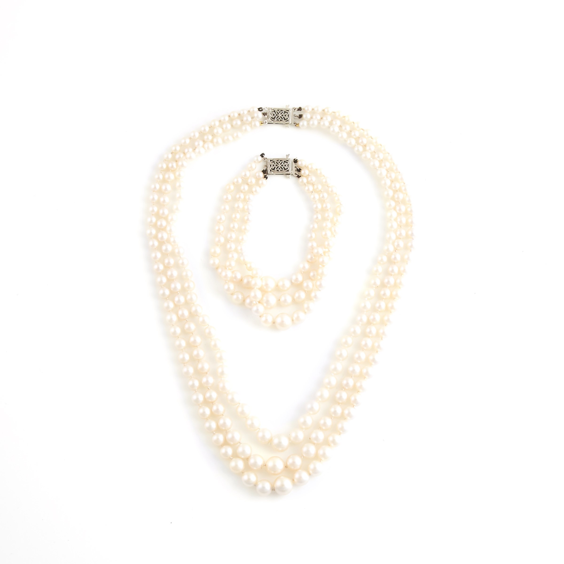 Graduated Triple Strand Cultured Pearl Necklace And Bracelet