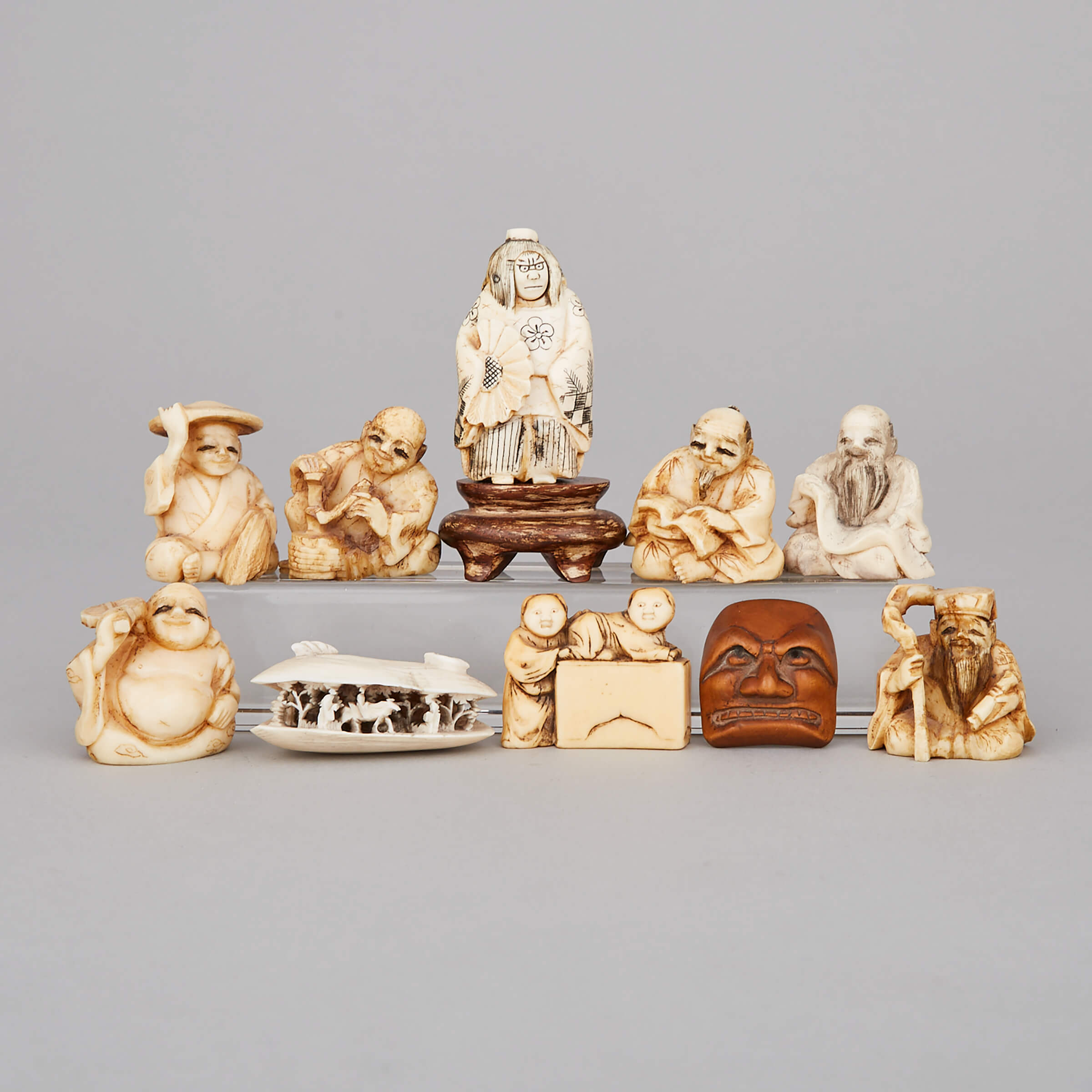 A Group of Ten Ivory and Wood Carved Netsukes