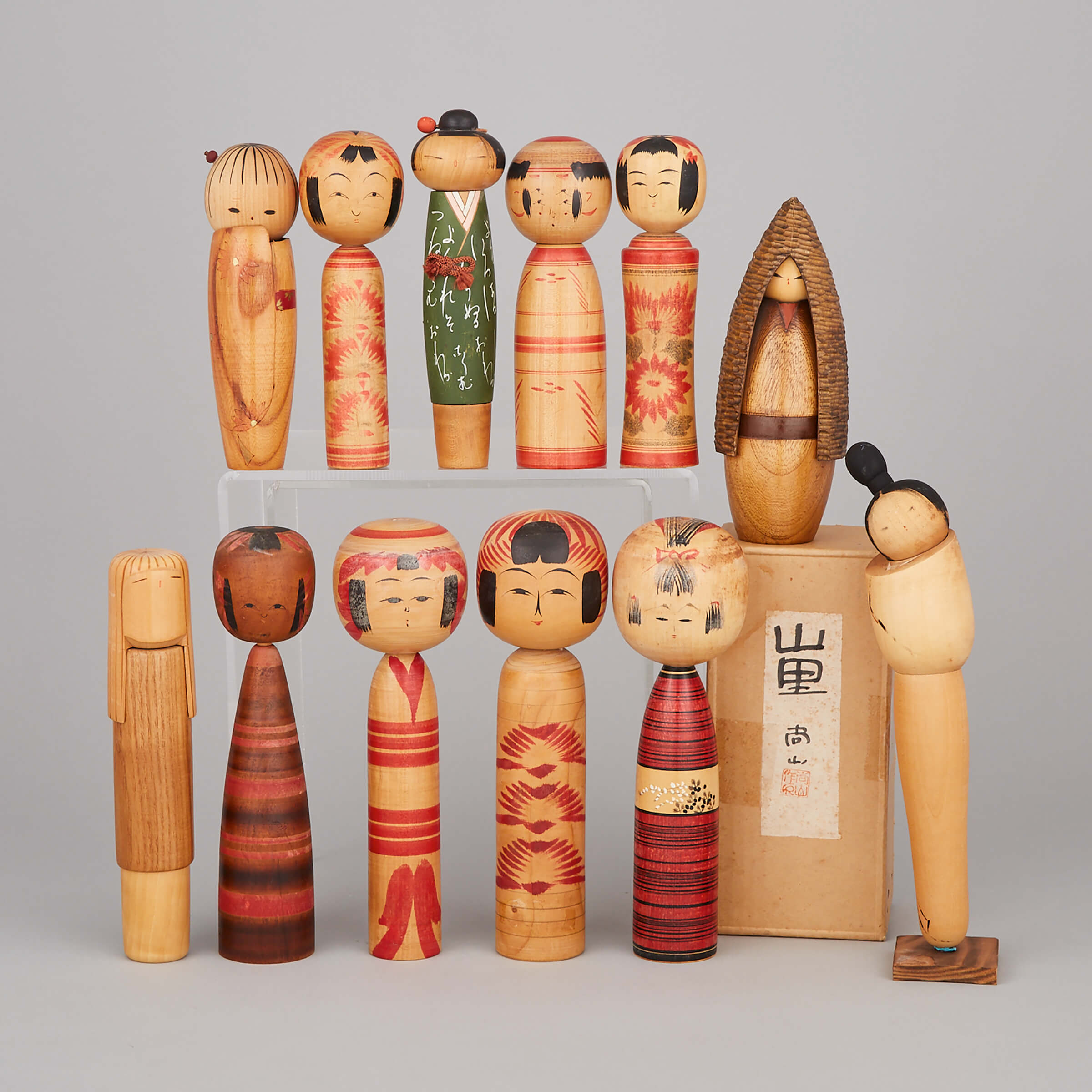 A Group of Twelve Kokeshi Dolls, Circa 1960 and Earlier