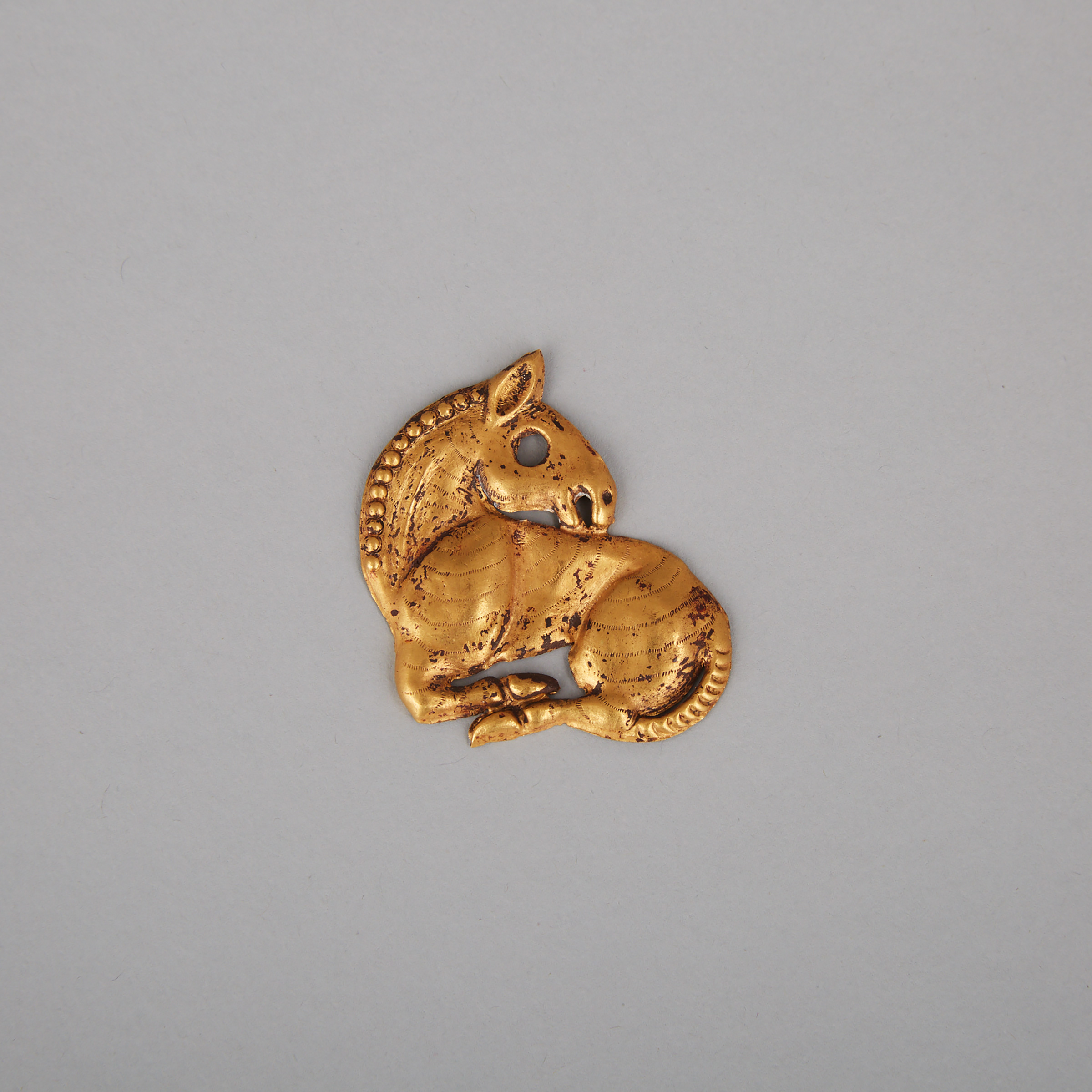 A Rare Solid Gold Horse Pendant Amulet, Ordos Region, Warring States Period, 5th to 3rd Century BC