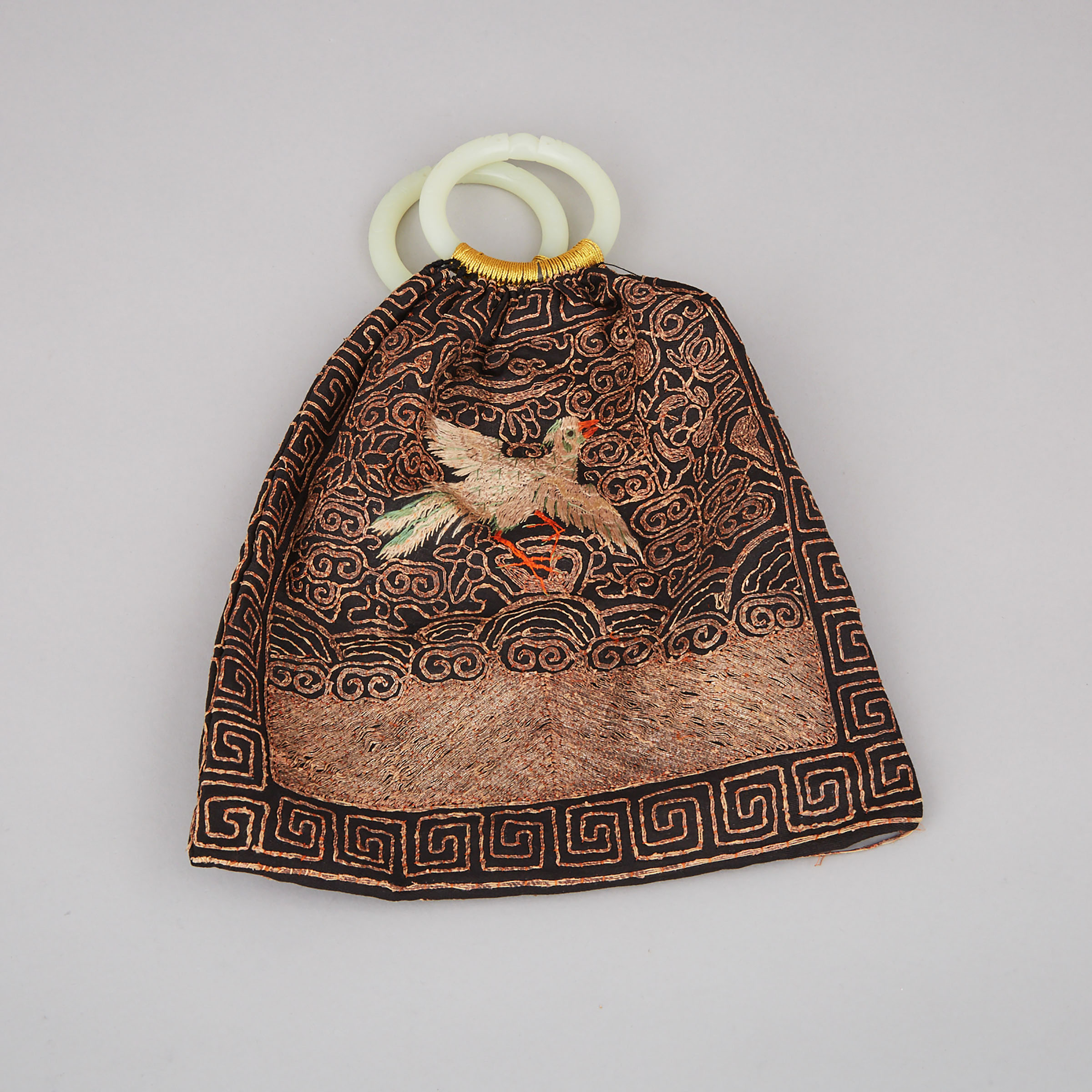A Silk Embroidered Purse with Jade Bangles