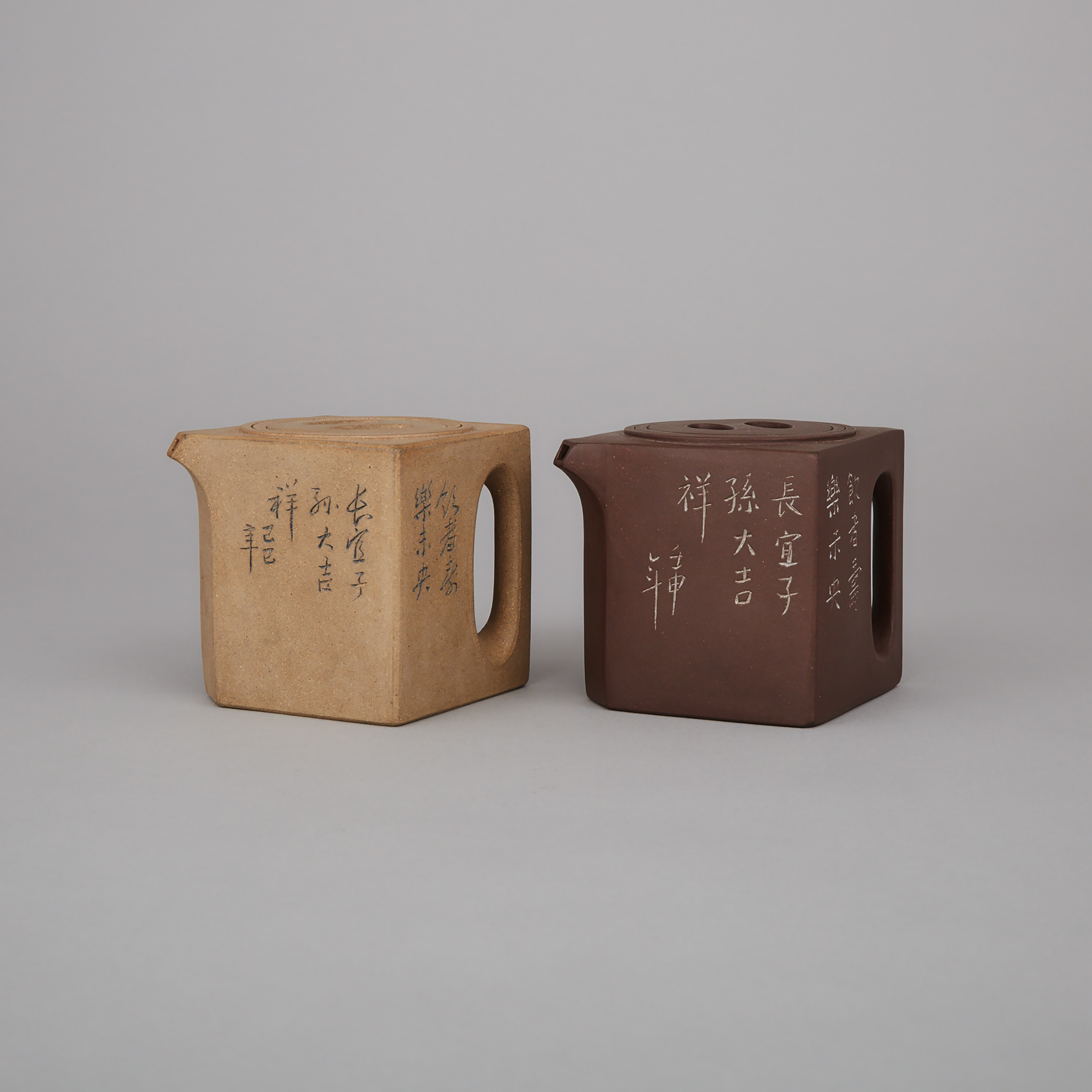A Pair of Inscribed and Faceted Yixing Stoneware Teapots and Covers