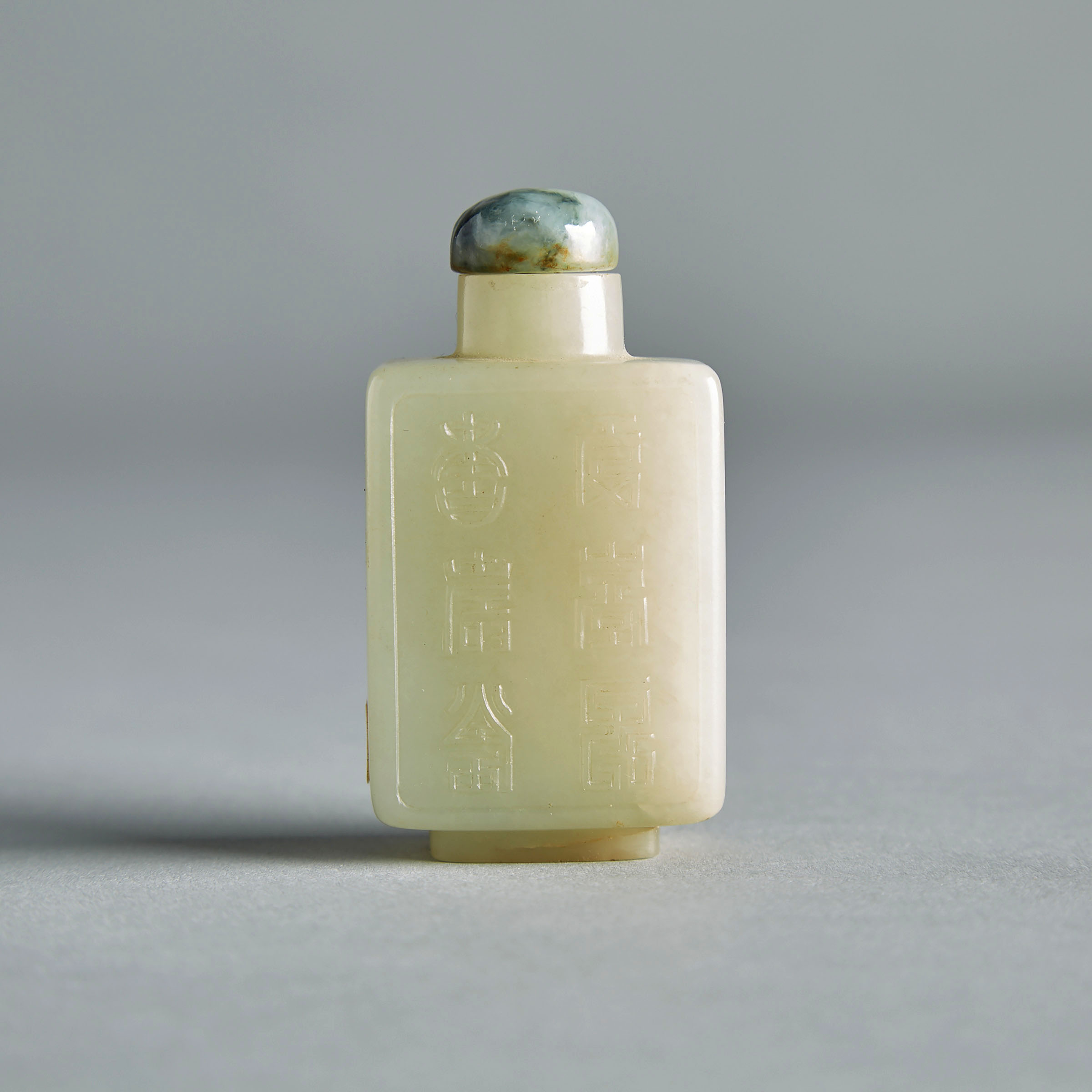 An Inscribed Celadon White Jade Snuff Bottle, 19th Century