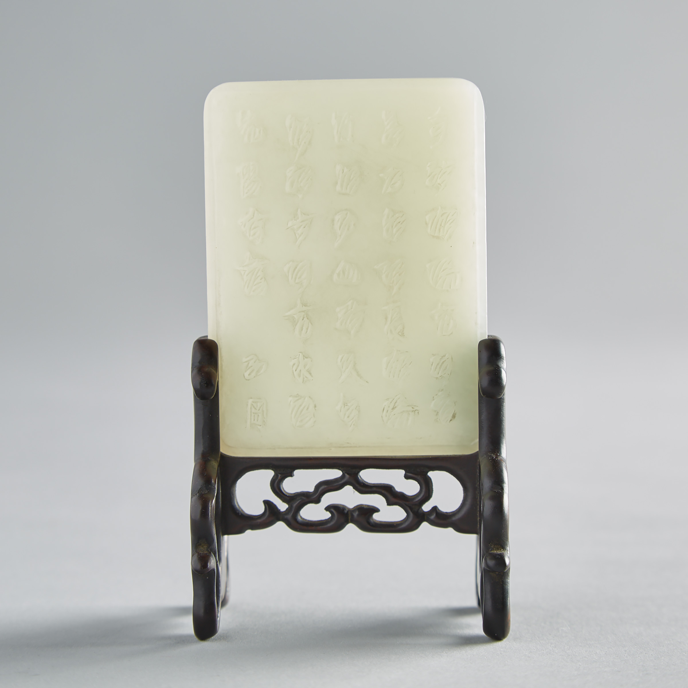 A Rectangular White Jade Plaque Mounted on a Stand
