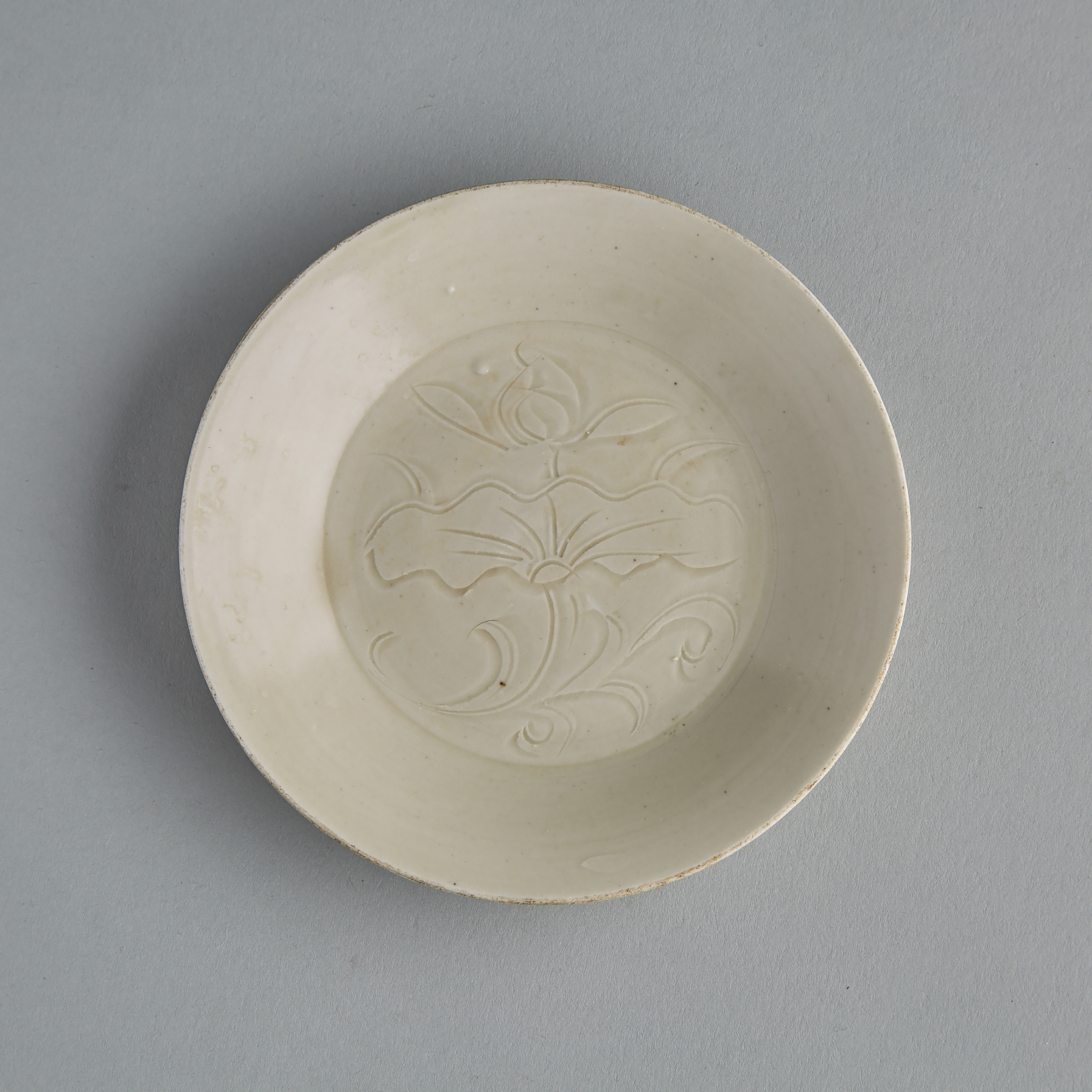 A Finely Incised Dingyao ‘Lotus’ Dish