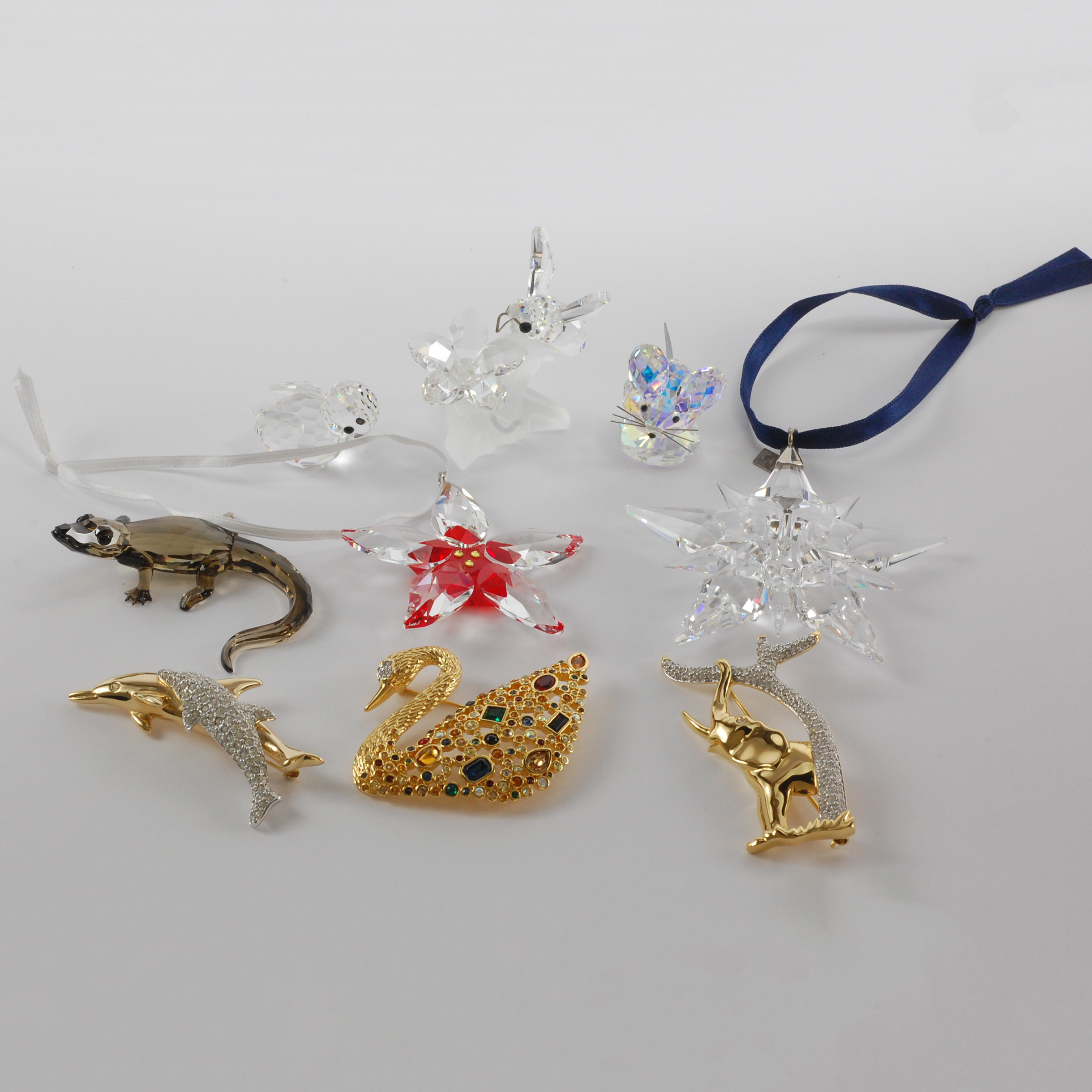 Five Swarovski Crystal Small Animal Figurines, Two Christmas Ornaments and Three Brooches, late 20th/early 21st century