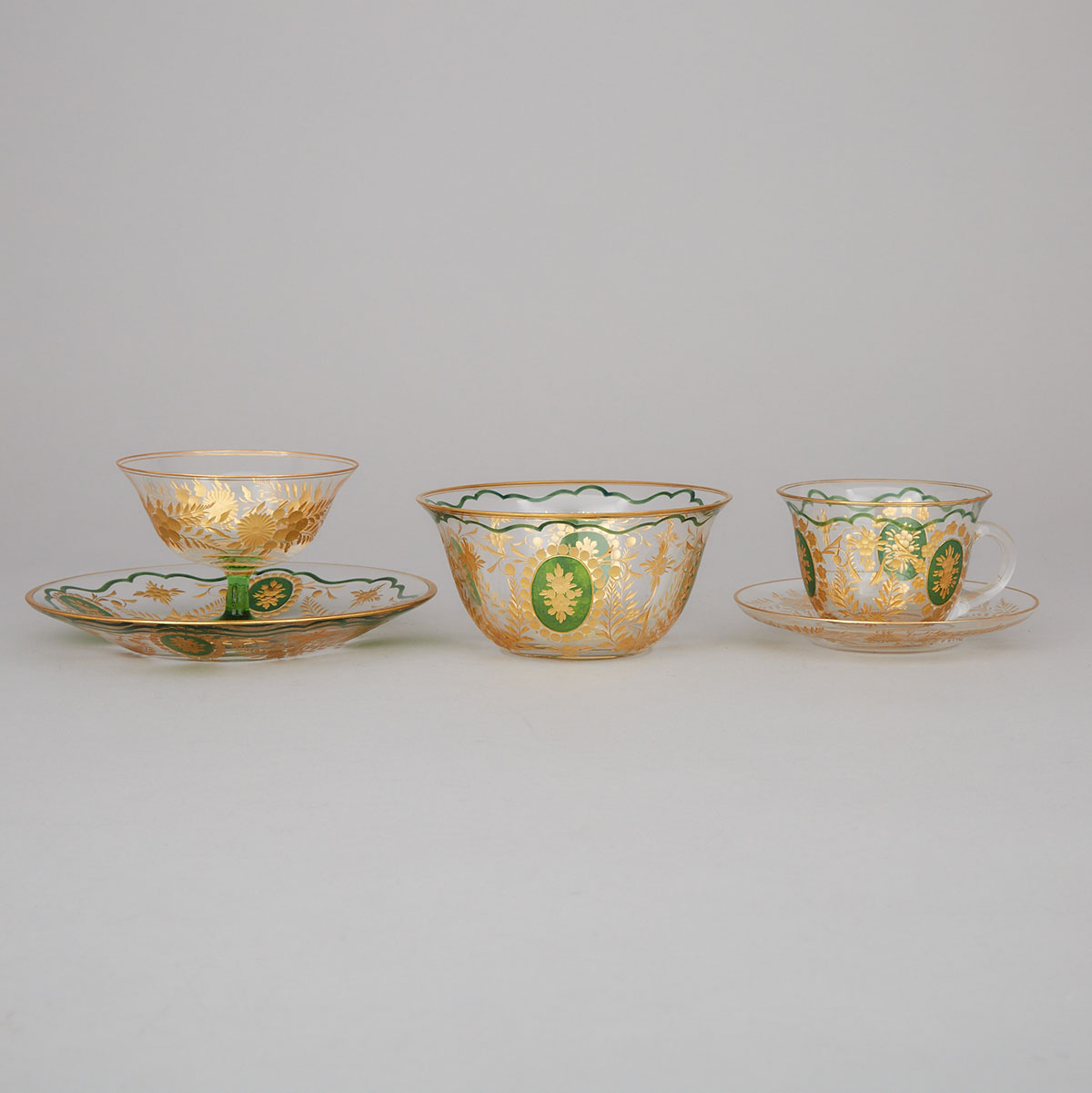 Bohemian Engraved, Green Enameled and Gilt Glass Service, early 20th century