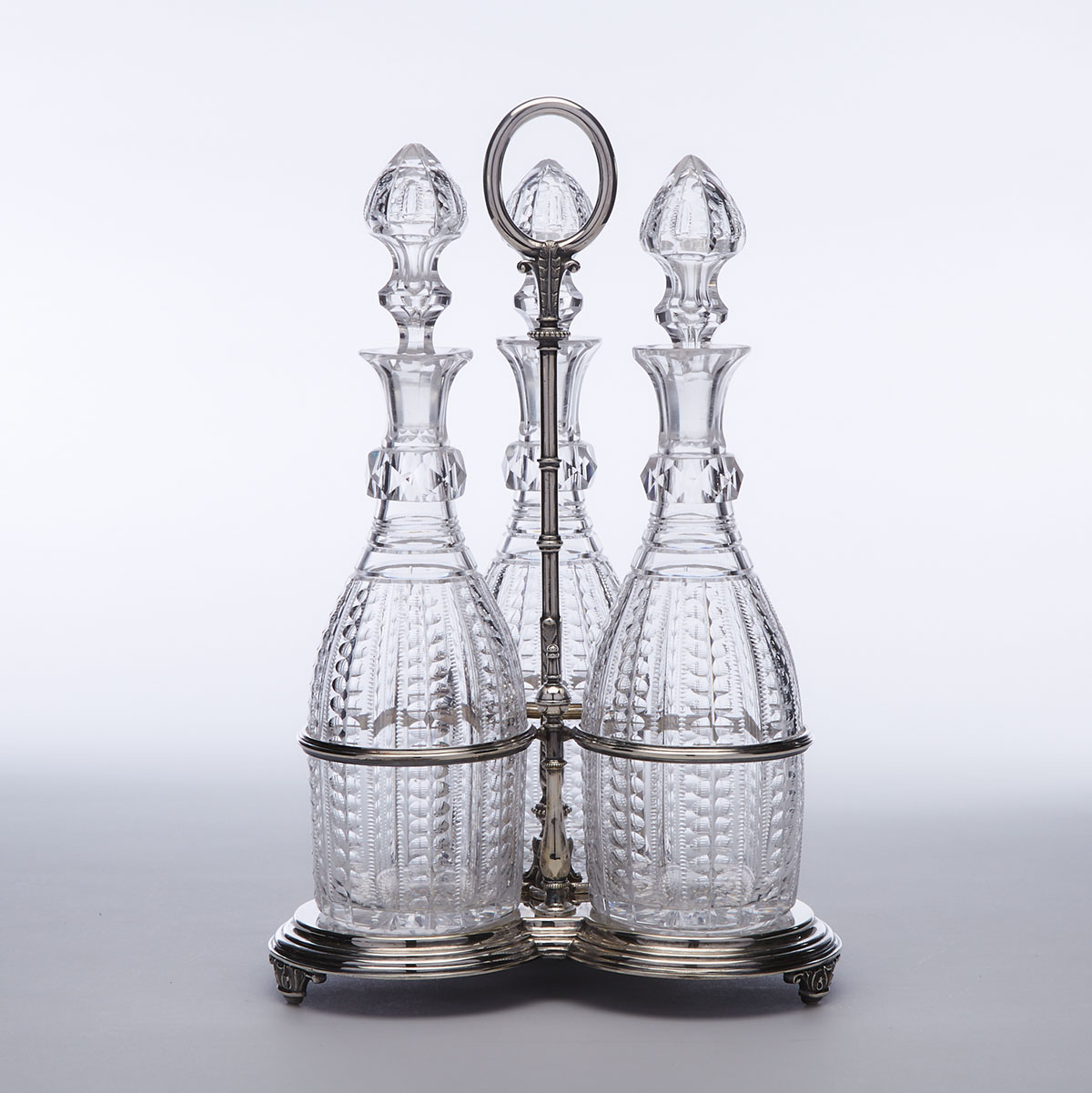 Victorian Silver Plate and Cut Glass Three-Bottle Tantalus, William Hutton & Sons, late 19th century