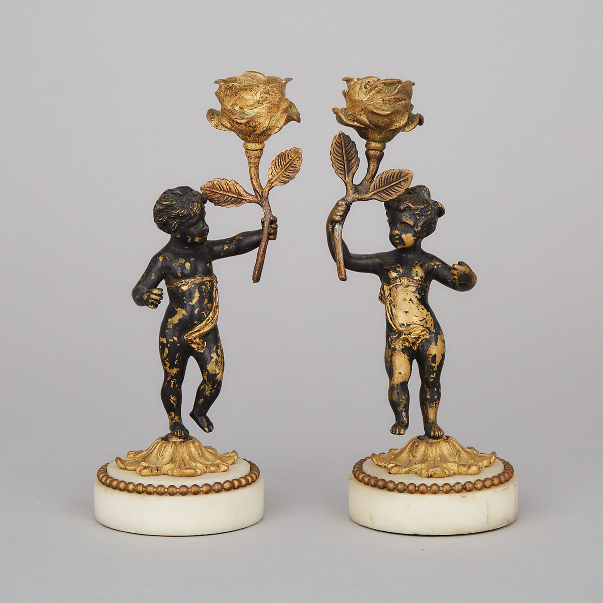 Pair of French Patinated and Gilt Bronze Figural Candlesticks, 19th century