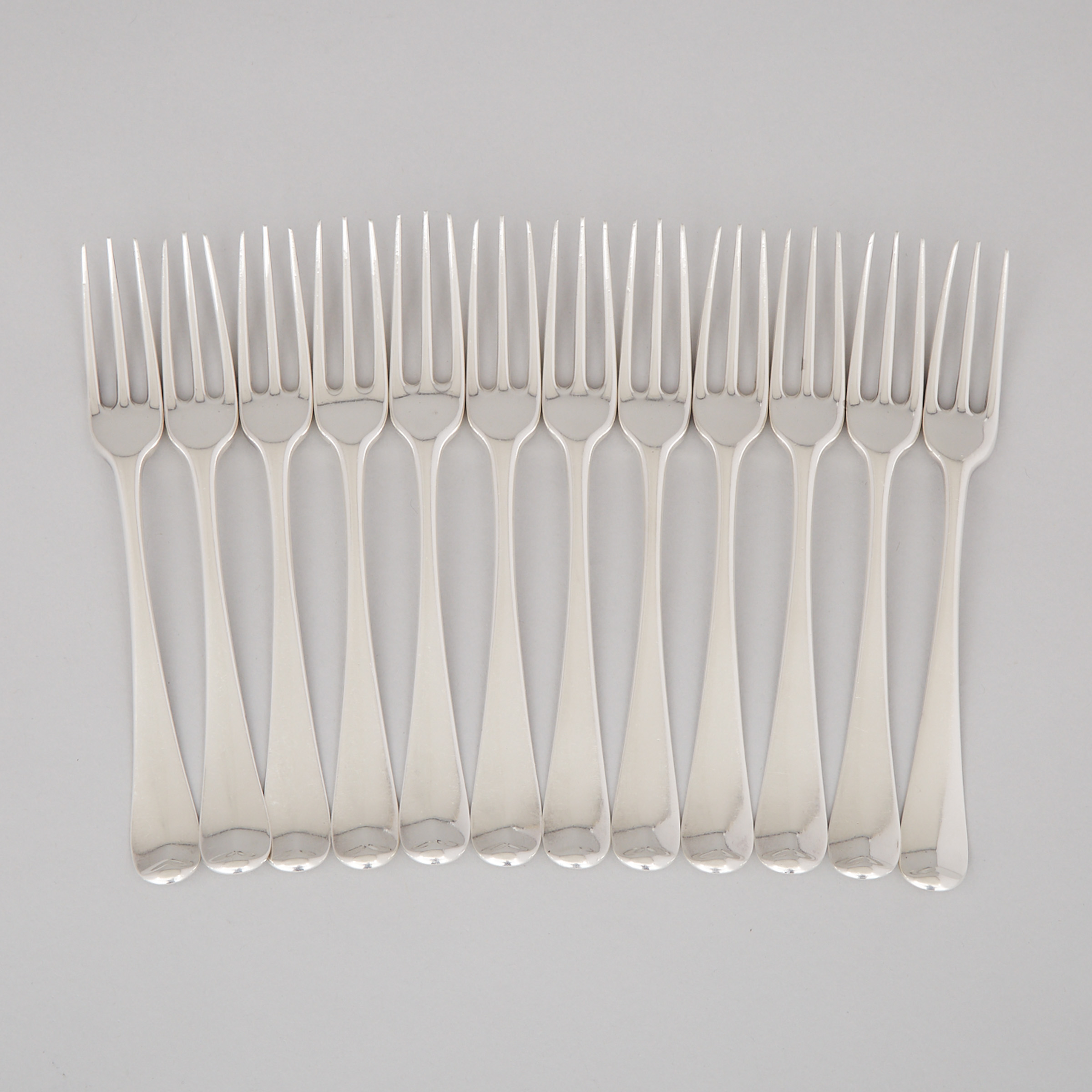 Twelve George II Silver Hanovarian Pattern Three-Pronged Table Forks, London, c.1752-66