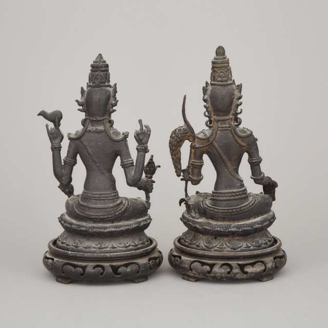 Two Indonesian Bronze Seated Figures of Vishnu and Dewi Sri