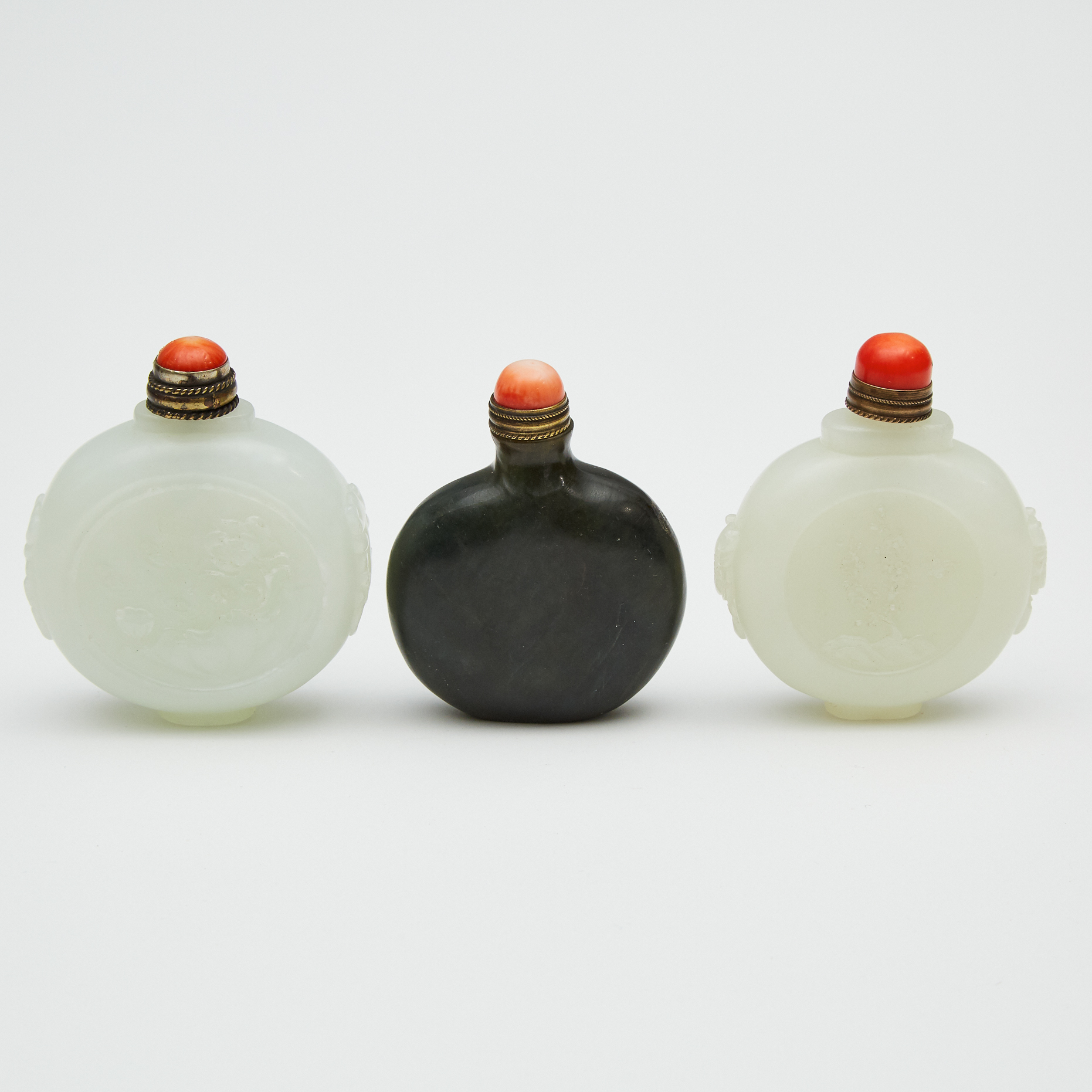 A Group of Three Jade Snuff Bottles