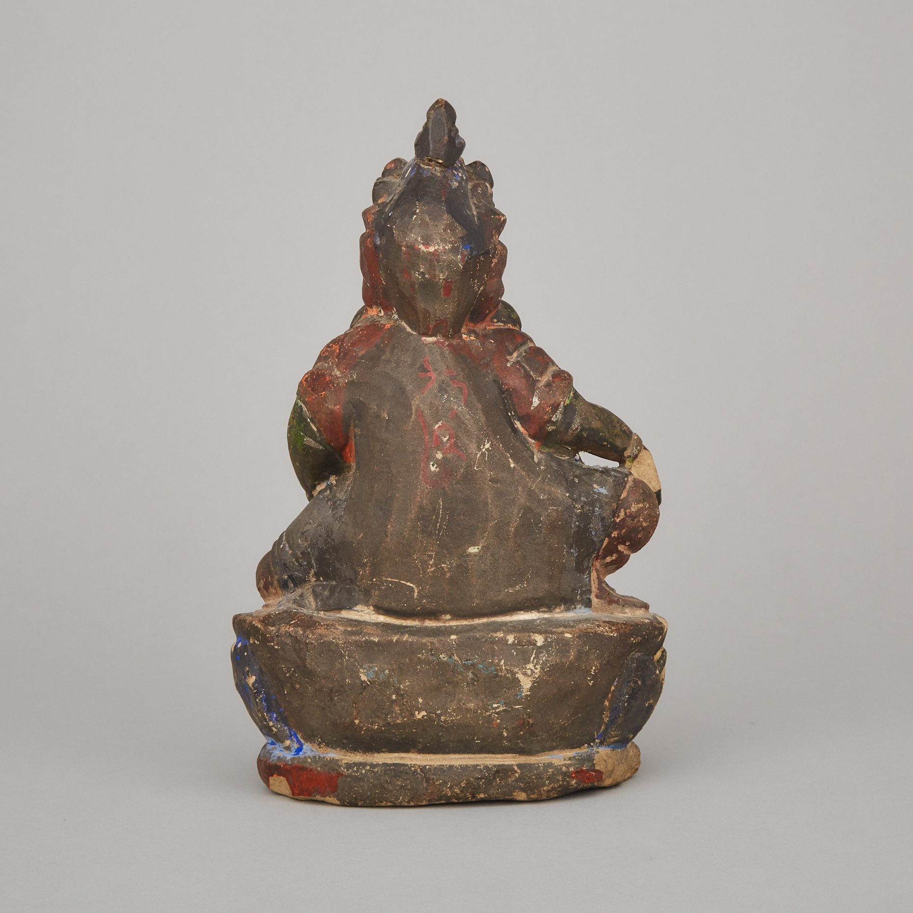 A Polychrome Sandstone Figure of Jambhala, 17th Century