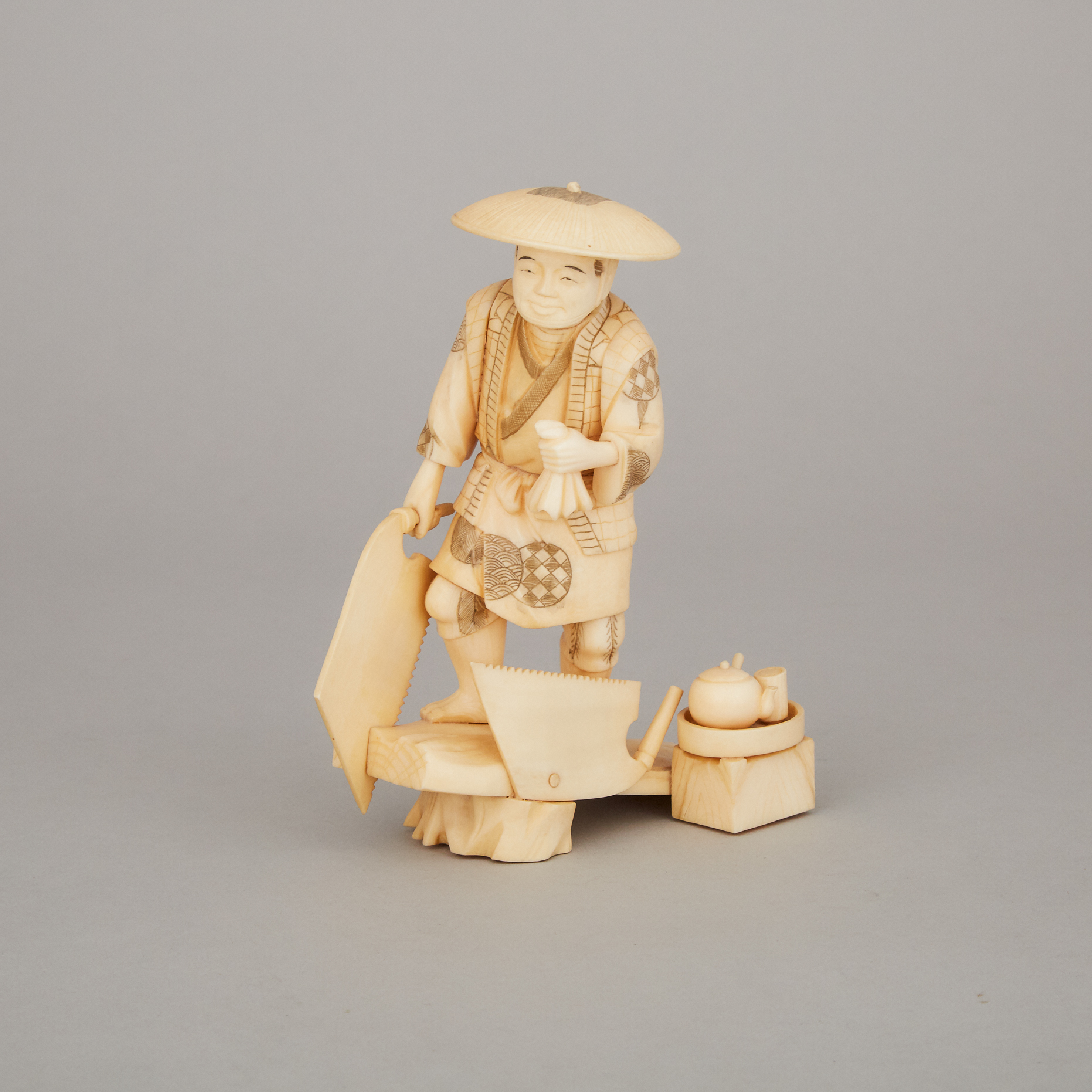 An Ivory Okimono of a Woodcutter, Meiji Period