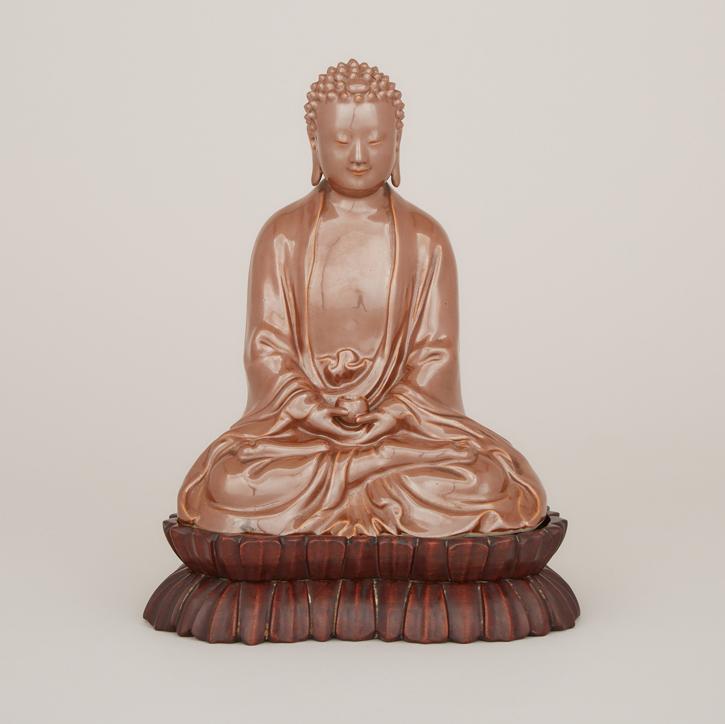 A Cafe-au-Lait Glazed Porcelain Buddha, Mark of Zeng Longsheng (1901-1964), Republic Period