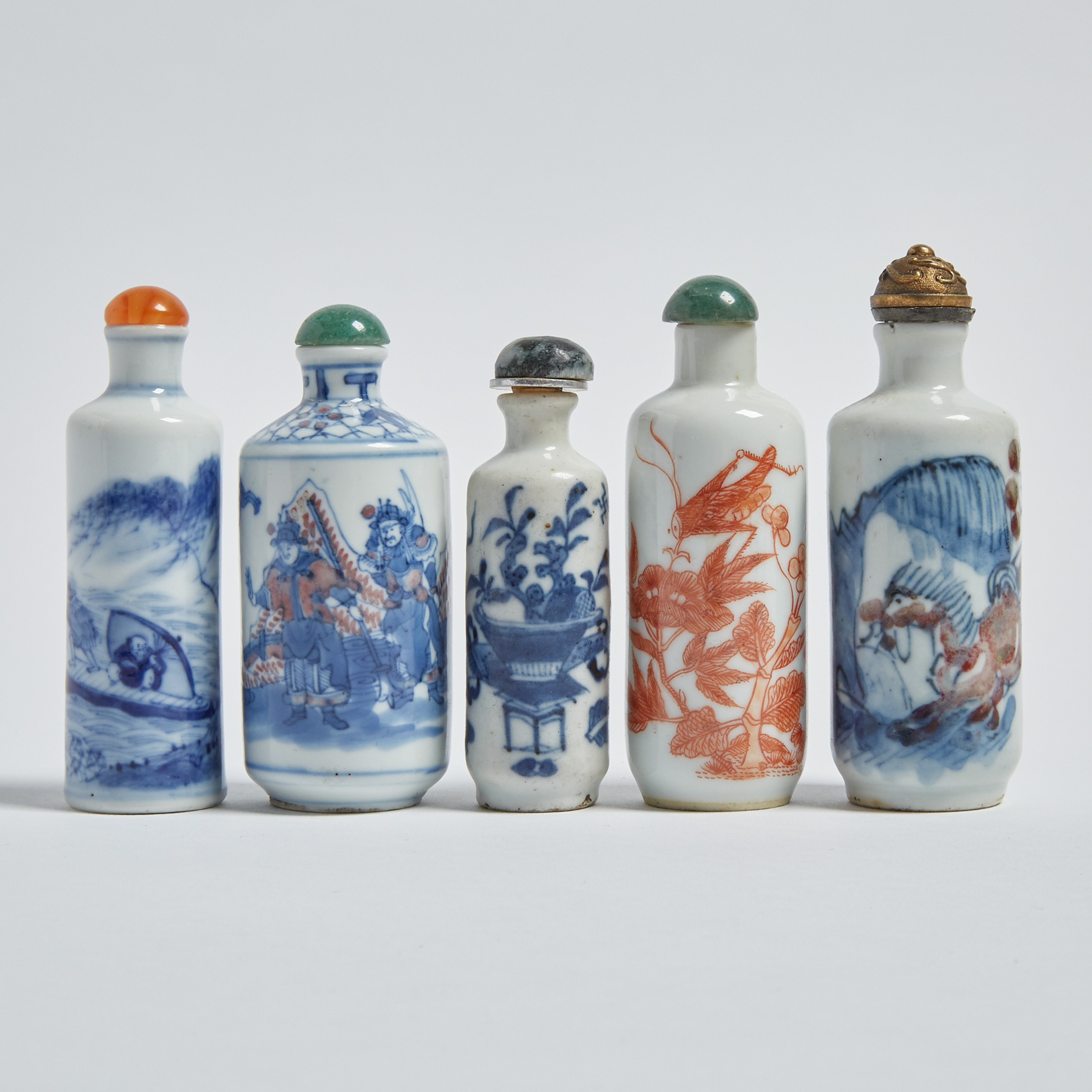 A Group of Five Blue and White and Copper-Red Snuff Bottles, 19th/Early 20th Century