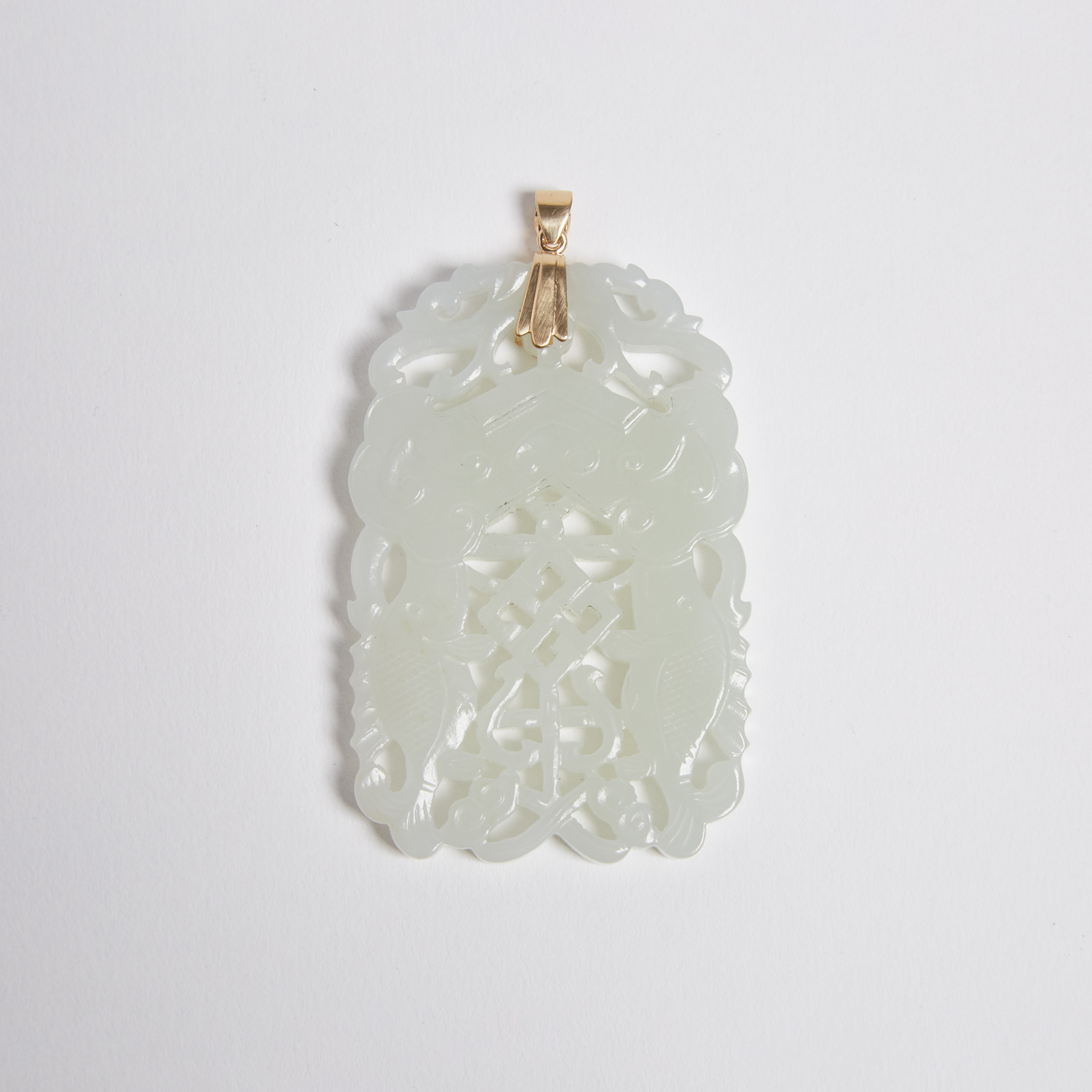 A White Jade Reticulated 'Double-Fish' Plaque