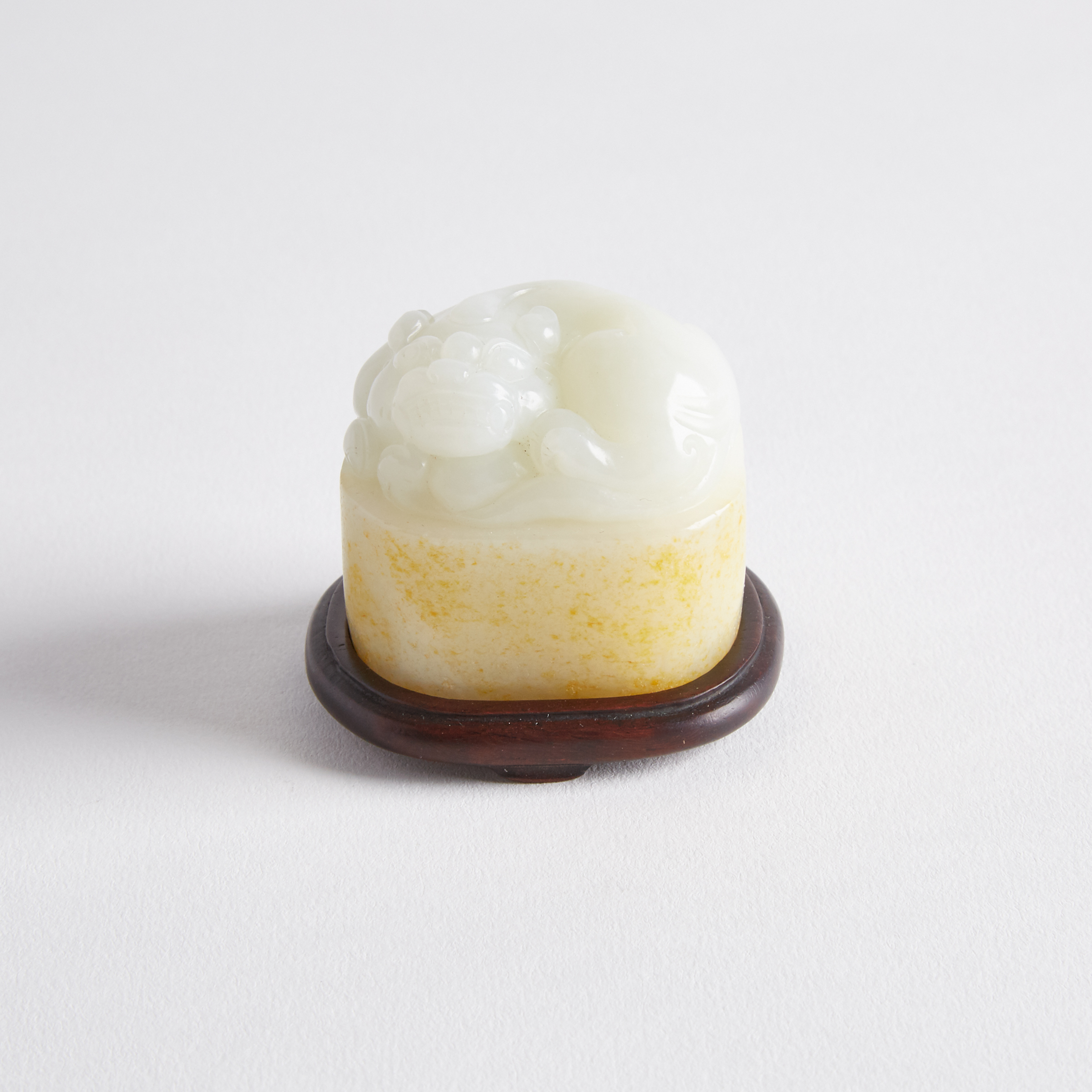 A White and Russet Jade Carved Lion Seal