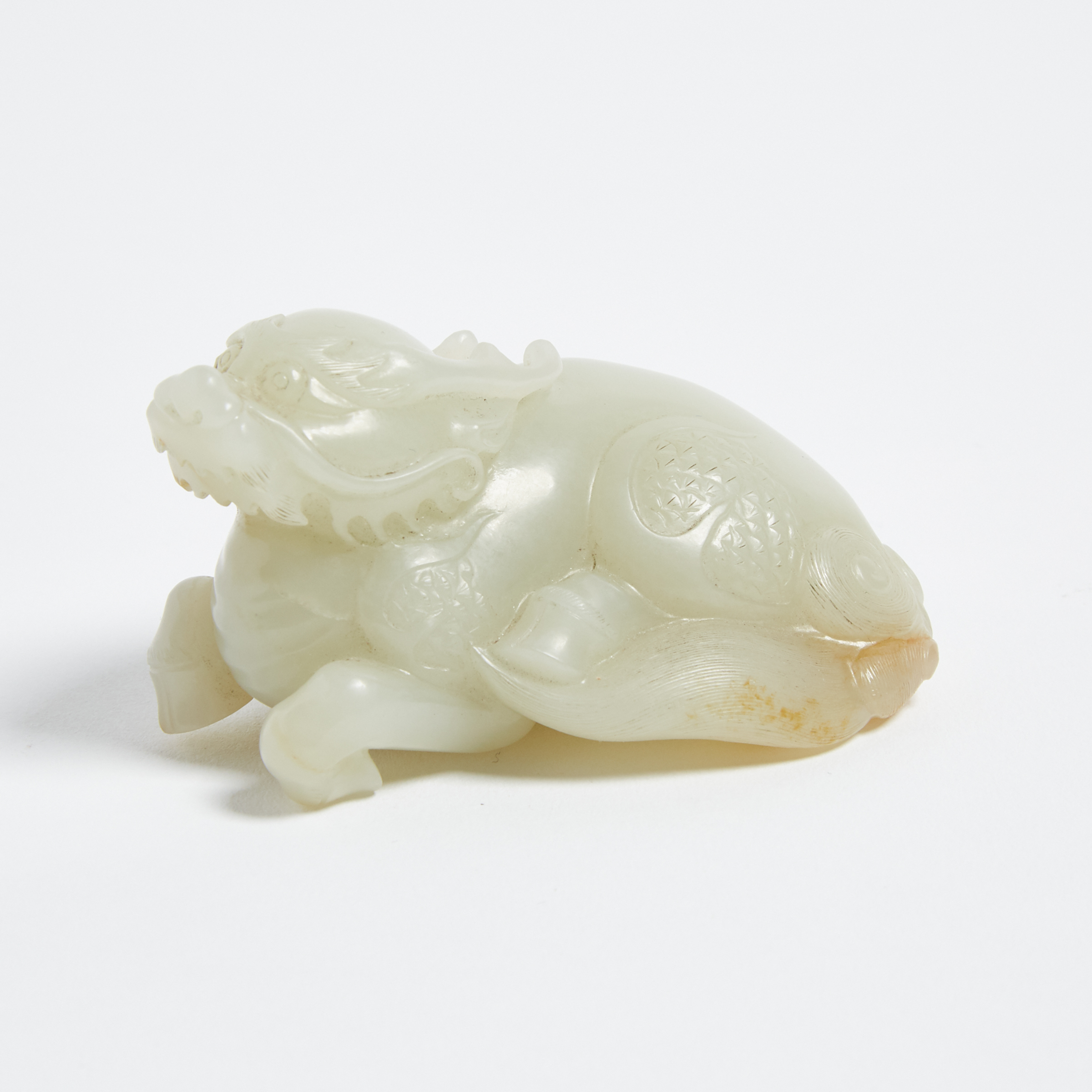 A White and Russet Jade Carved Qilin