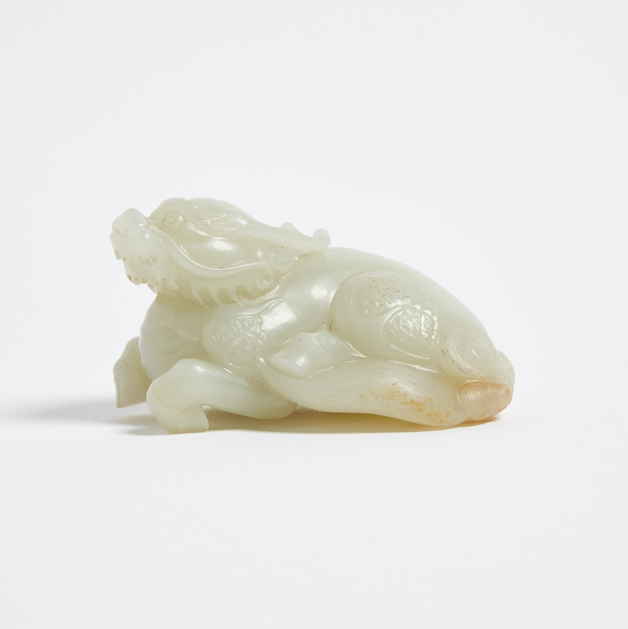 A White and Russet Jade Carved Qilin