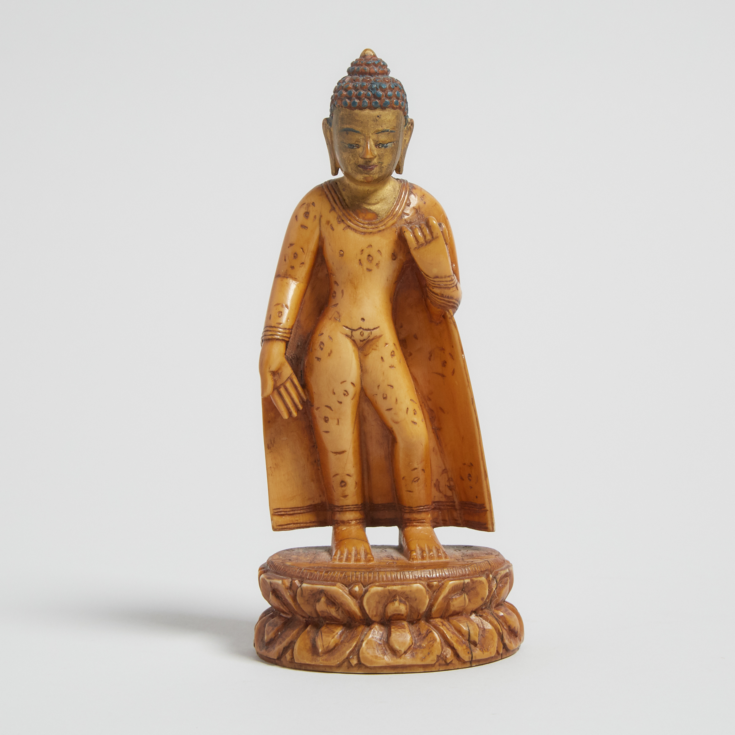 A Gilt Painted Ivory Figure of Shakyamuni