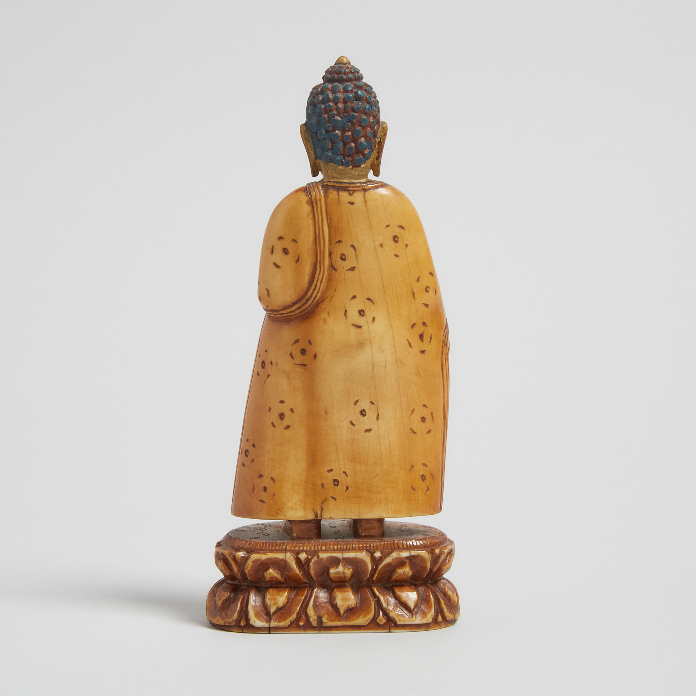 A Gilt Painted Ivory Figure of Shakyamuni