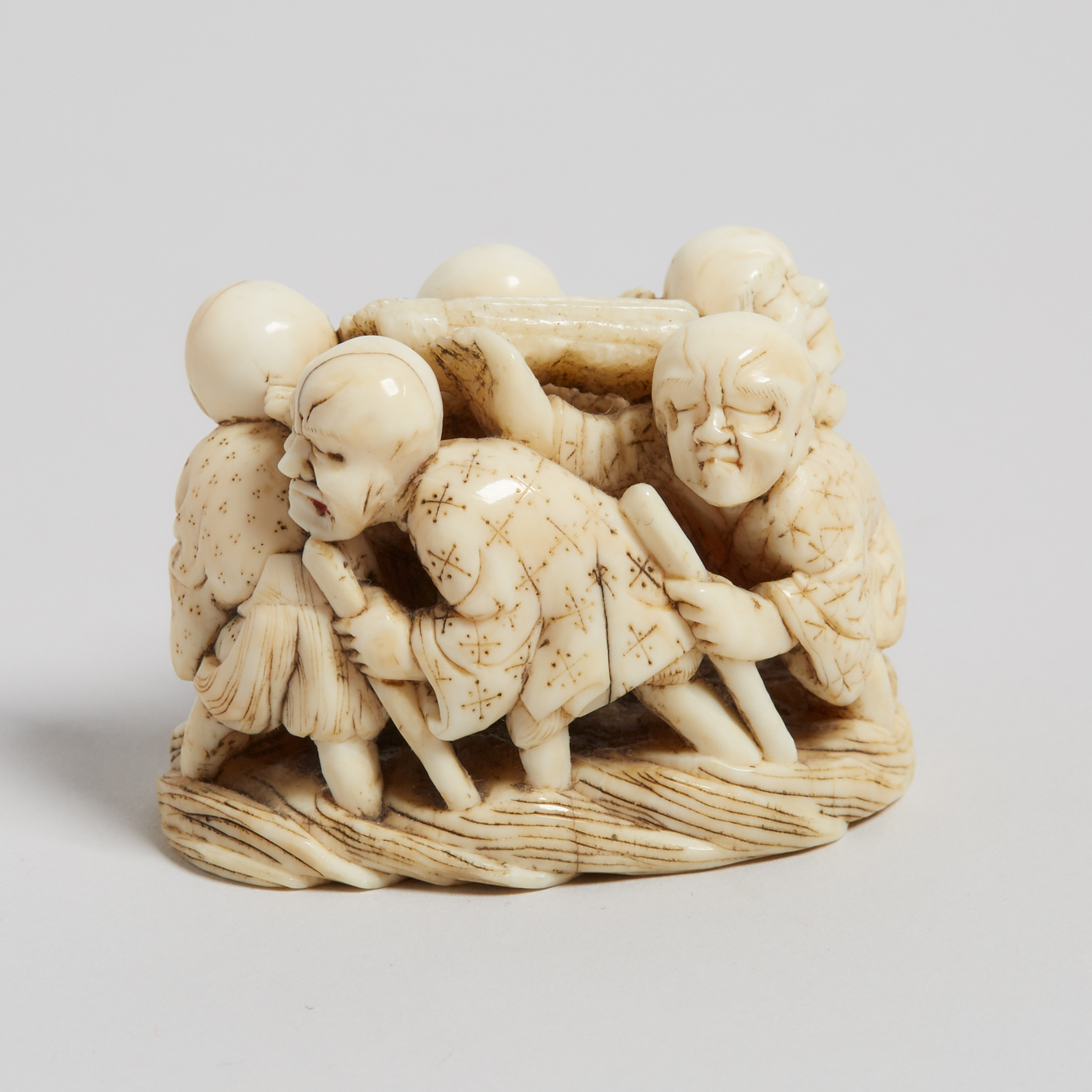 An Ivory Carved 'Blind Men' Group Netsuke, Meiji Period