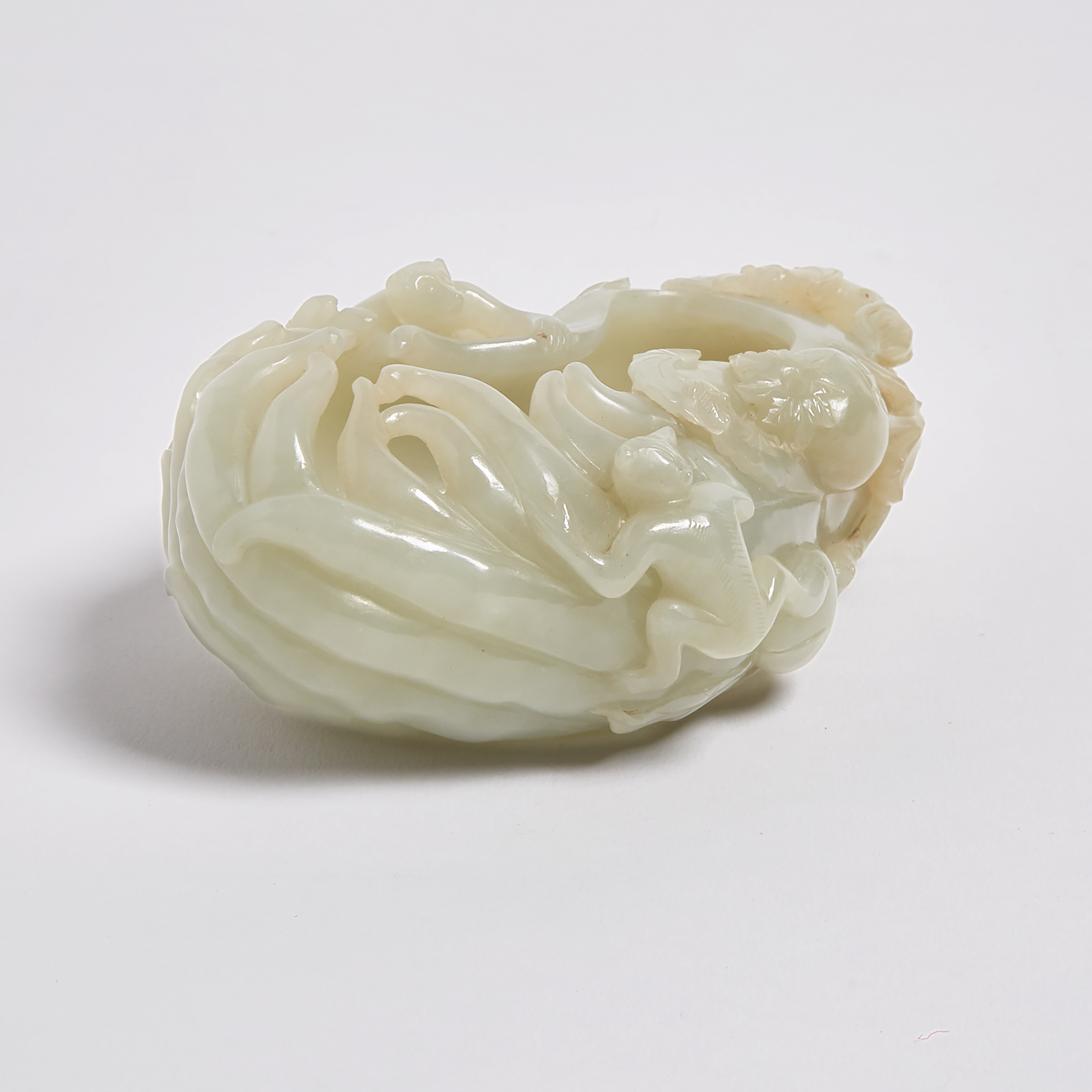 A Celadon Jade 'Buddha's Hand Citron and Monkeys' Washer, 18th/19th Century