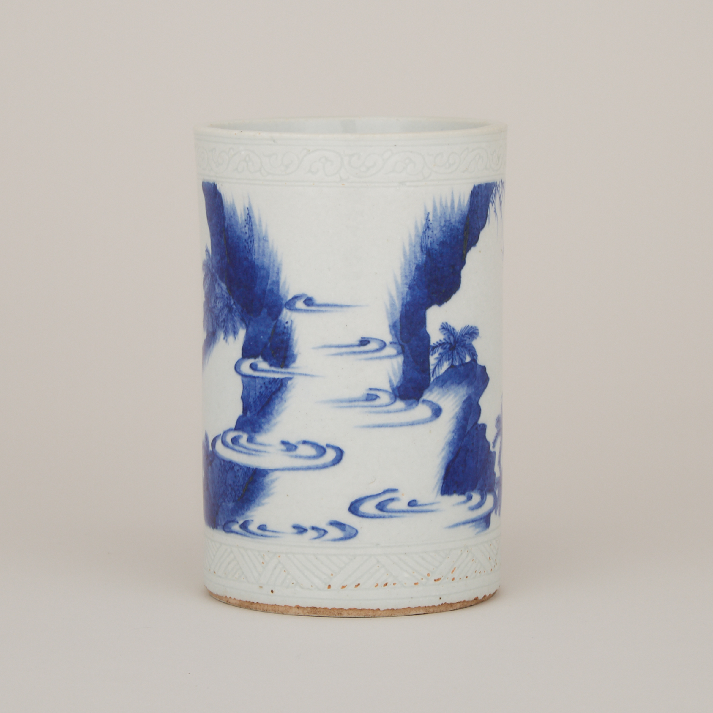 A Small Blue and White Figural Brushpot