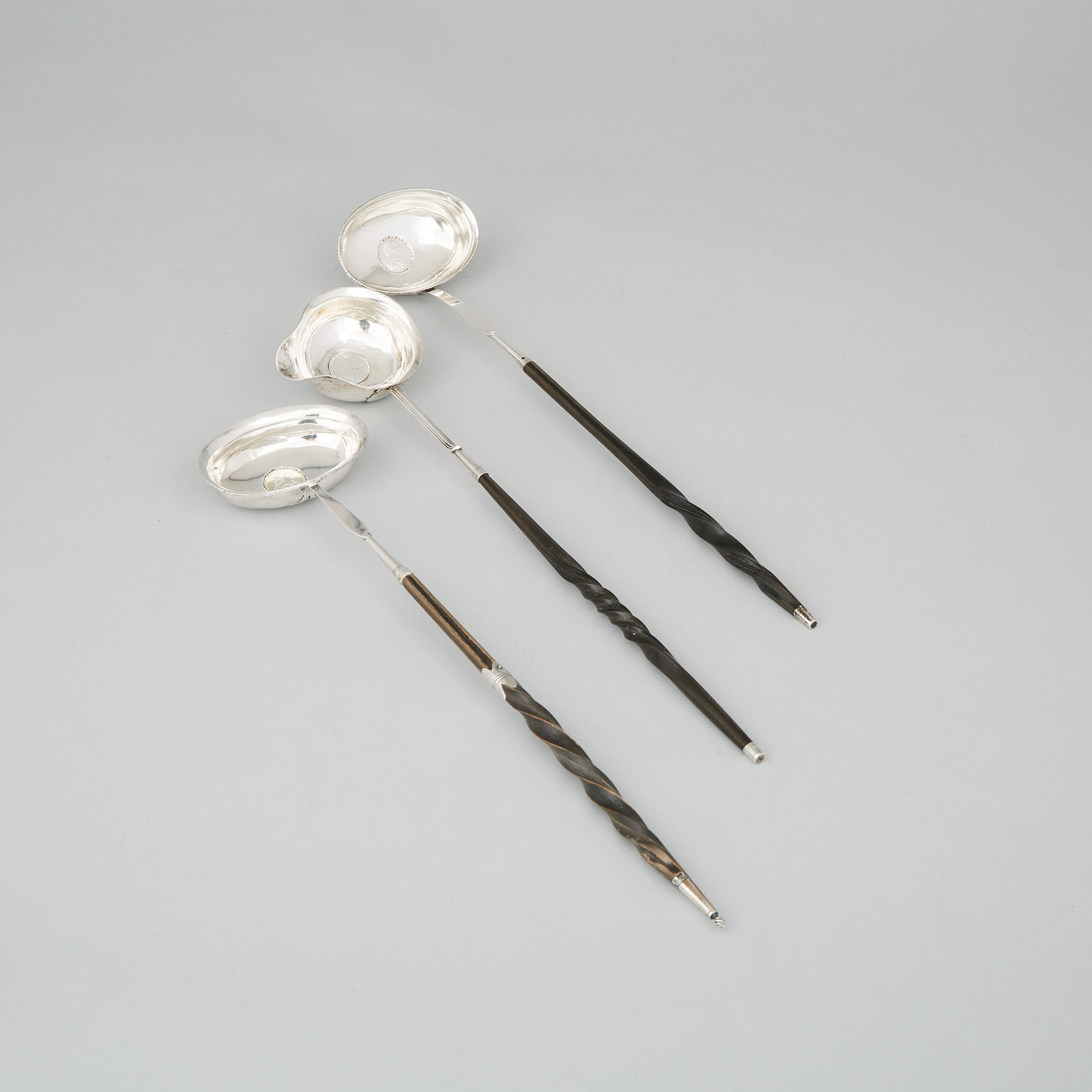 Three George III Silver Toddy Ladles, late 18th century