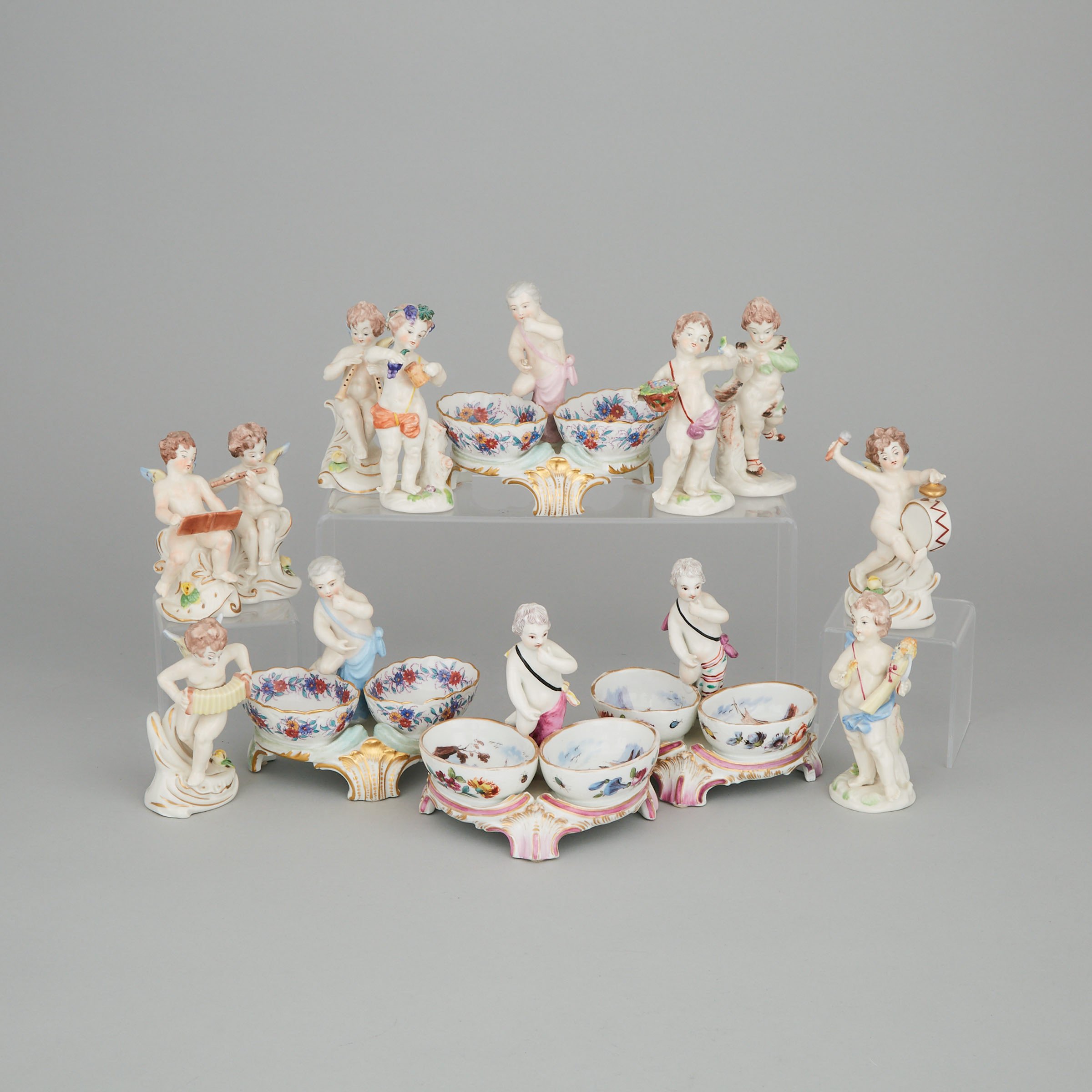 Two Pairs of Continental Porcelain Double Salt Cellars and Nine Small Figures, late 19th/20th century