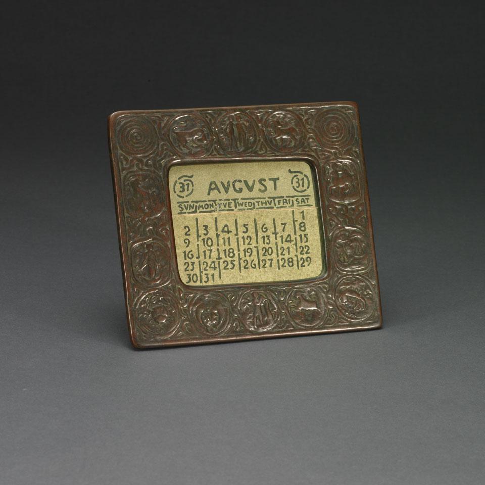 Tiffany Studios Patinated Bronze ‘Zodiac’ Desk Calendar or Photograph Frame, early 20th century
