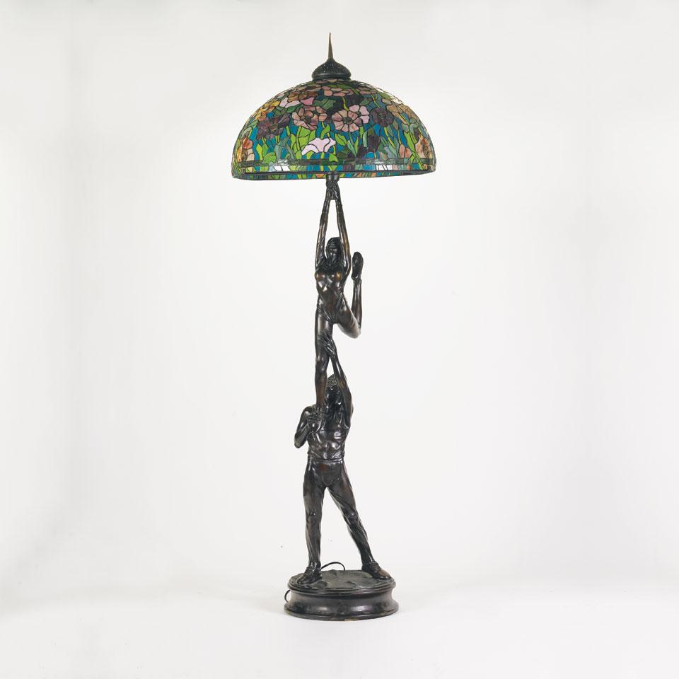 Tiffany-Style Patinated Bronze and Leaded Glass Figural Floor Lamp, 20th century