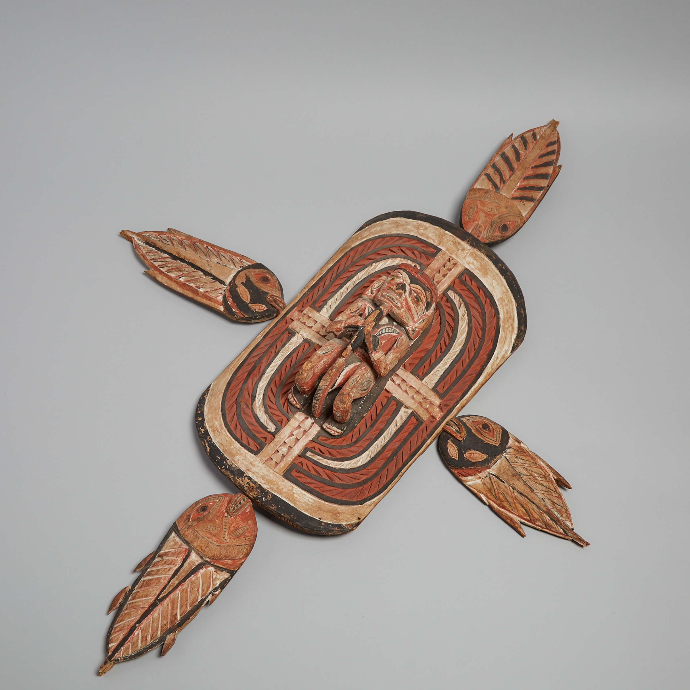 New Ireland Carved Wood and Polychromed Figural Plaque, Papua New Guinea, possibly 19th/ early 20th century