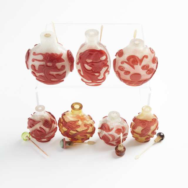 A Group of Seven Red Overlay Peking Glass Snuff Bottles, 19th/Early 20th Century