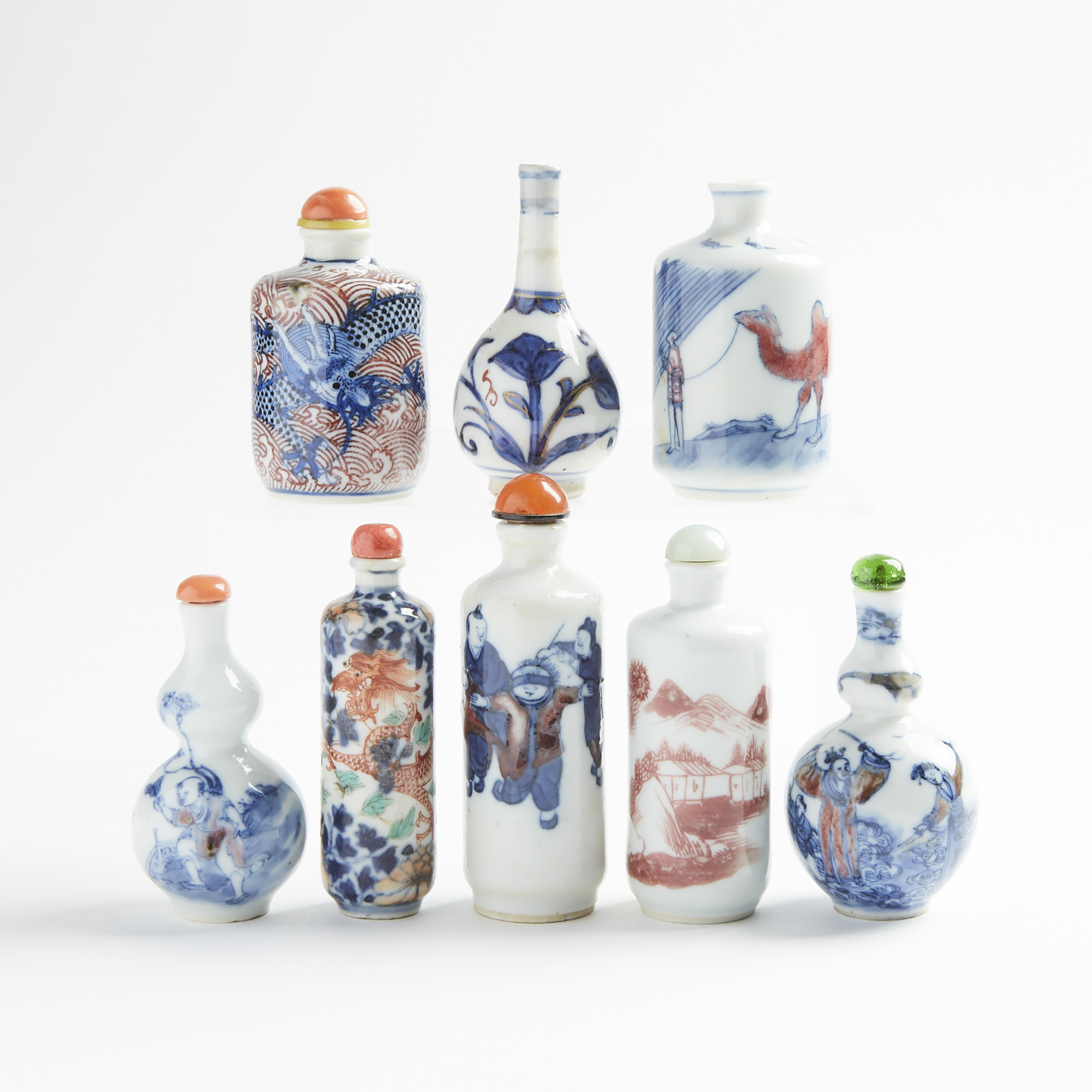 A Group of Eight Underglazed-Decorated Porcelain Snuff Bottles, 19th/20th Century