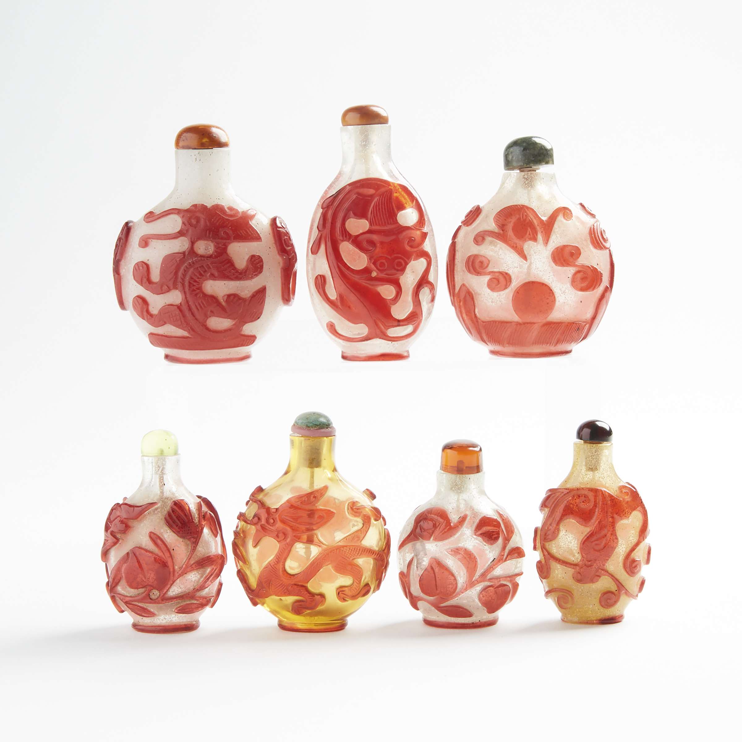 A Group of Seven Red Overlay Peking Glass Snuff Bottles, 19th/Early 20th Century