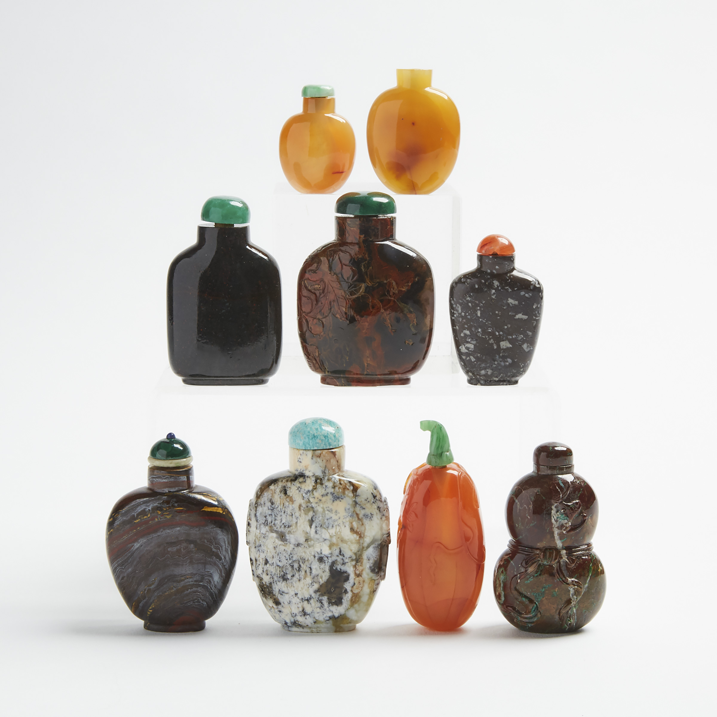 A Group of Nine Chalcedony Snuff Bottles, 19th/20th Century