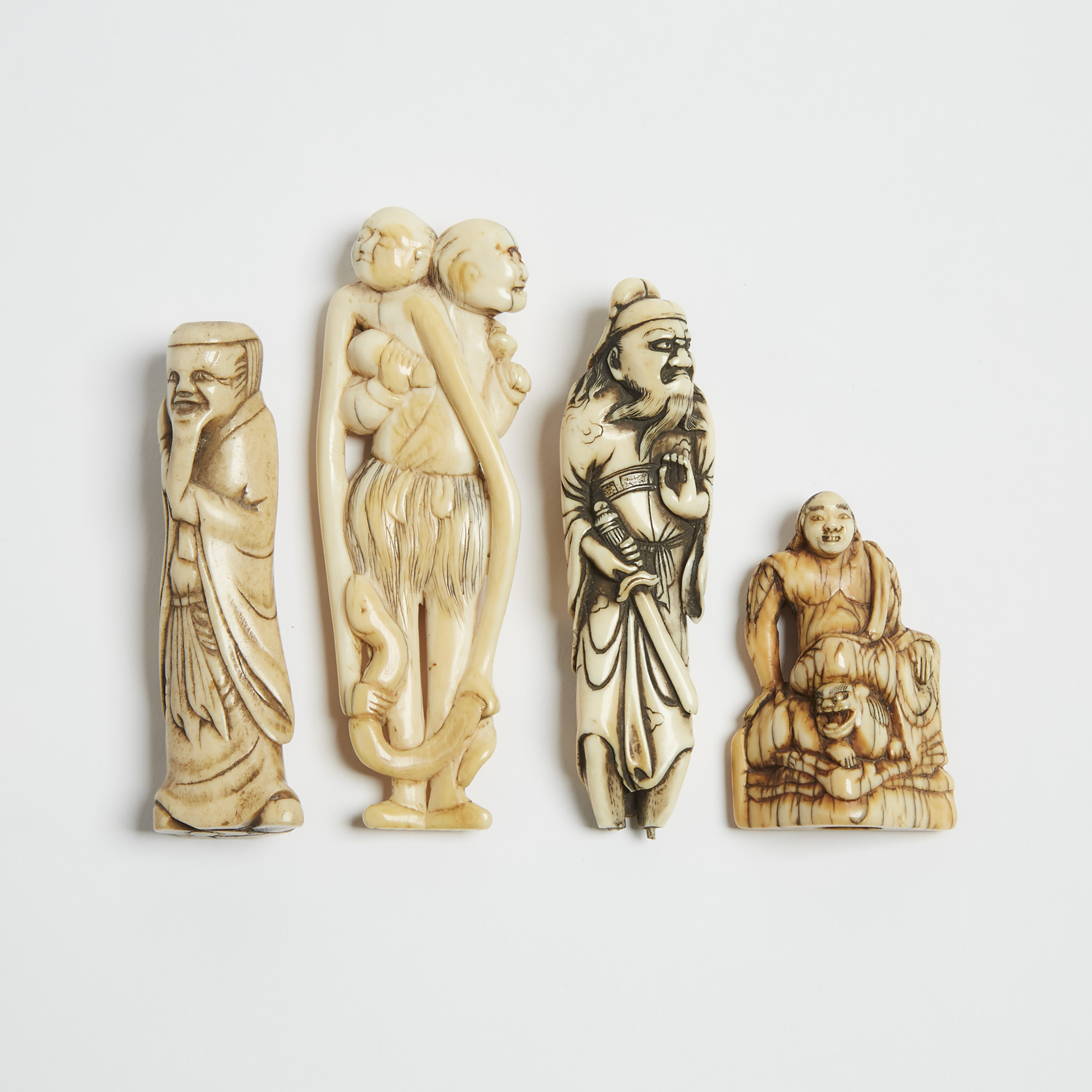 A Group of Four Ivory and Antler Netsuke, 18th/19th Century