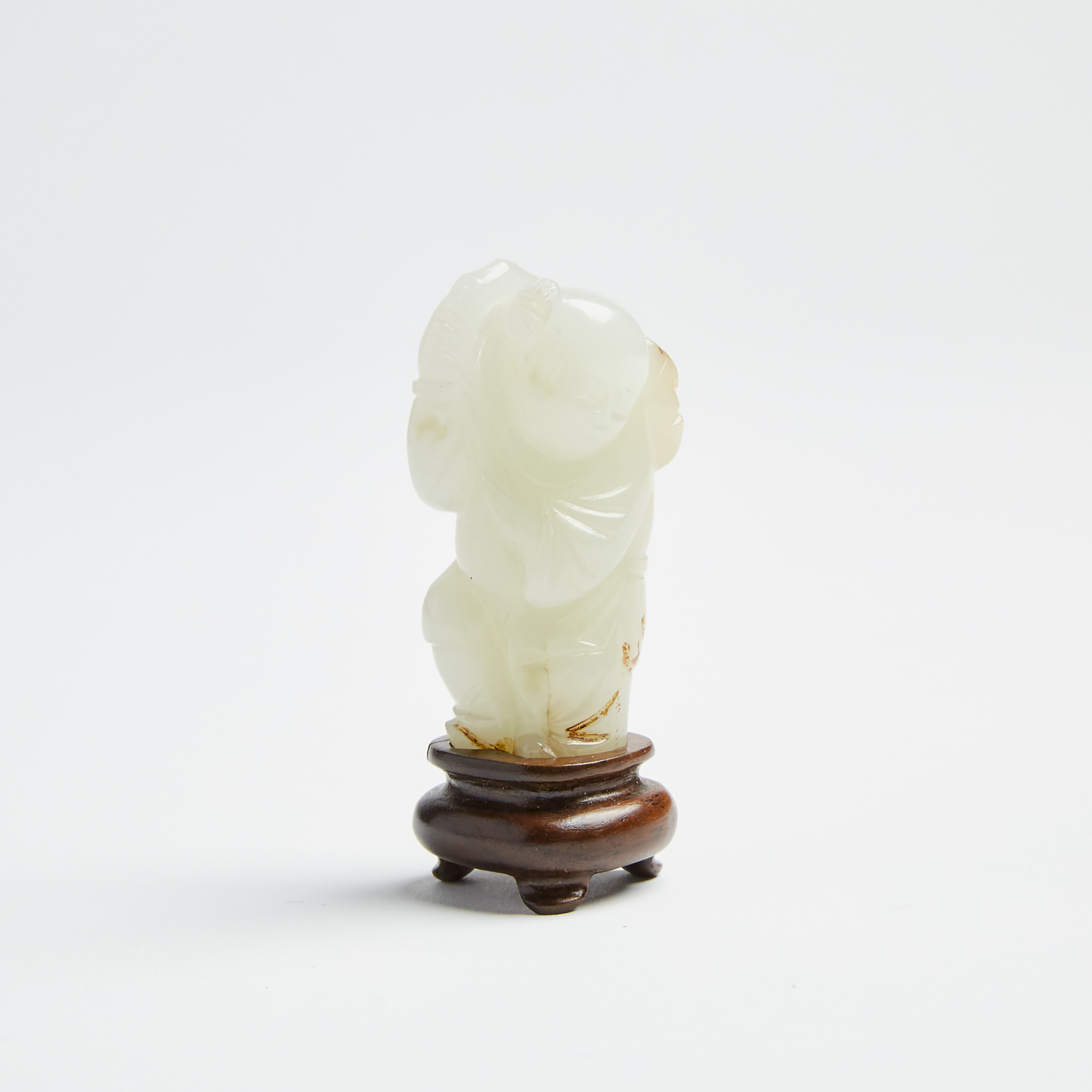 A White Jade Boy Holding Lingzhi Carving, Late Qing Dynasty