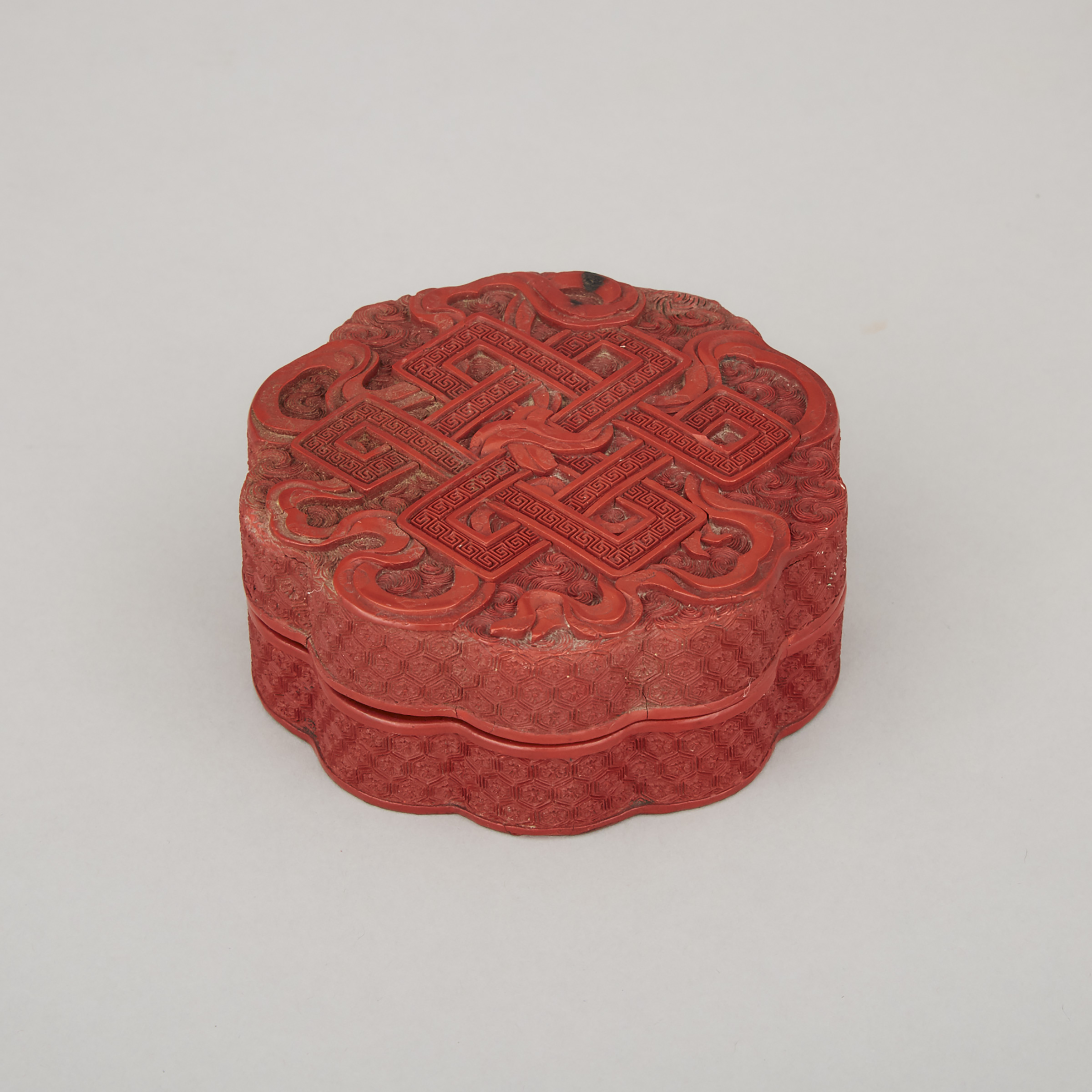 A Cinnabar Lacquer 'Endless Knot' Box and Cover, Qing Dynasty, 18th Century