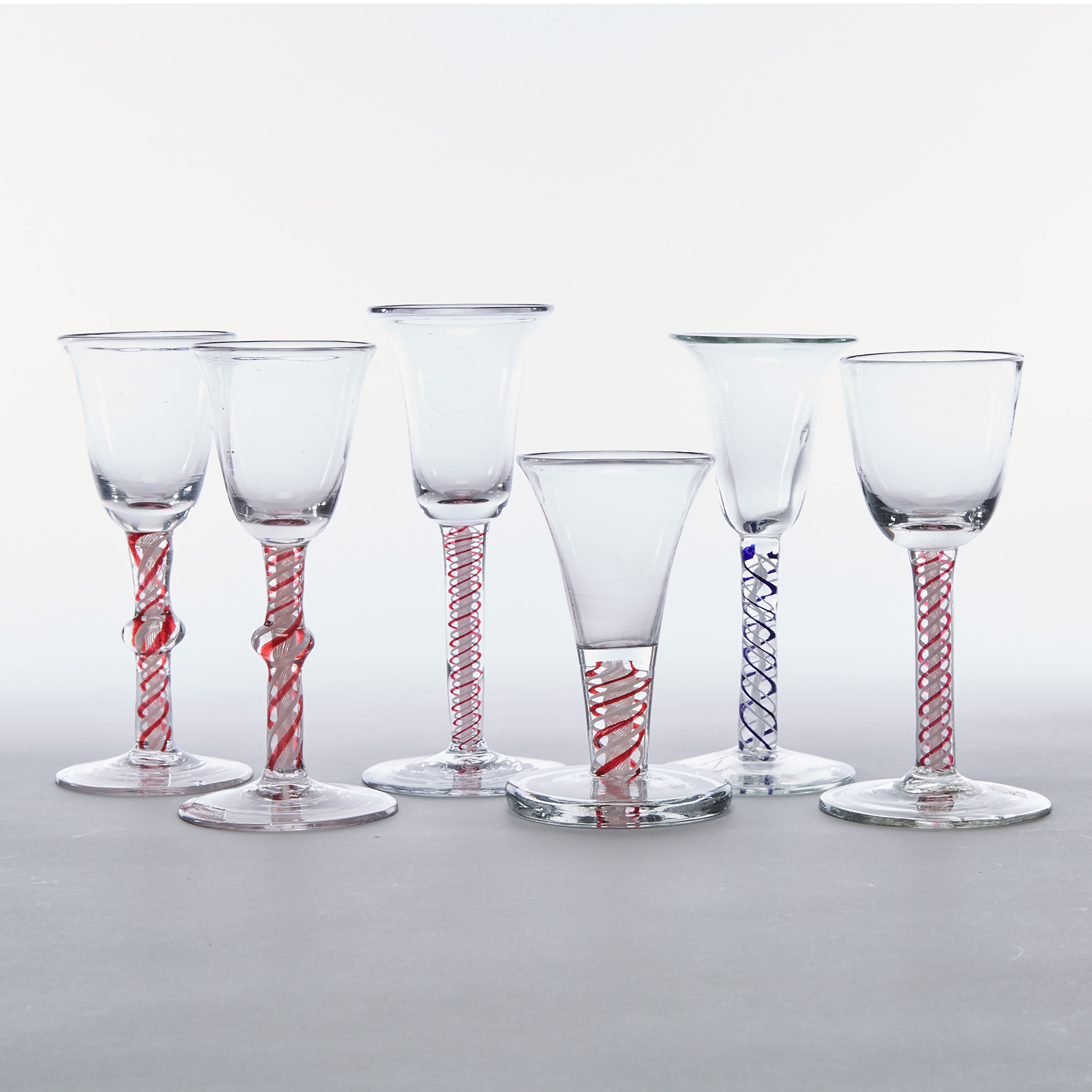 Six Various Continental Red or Blue Colour Twist Stemmed Wine Glasses, late 18th/19th century