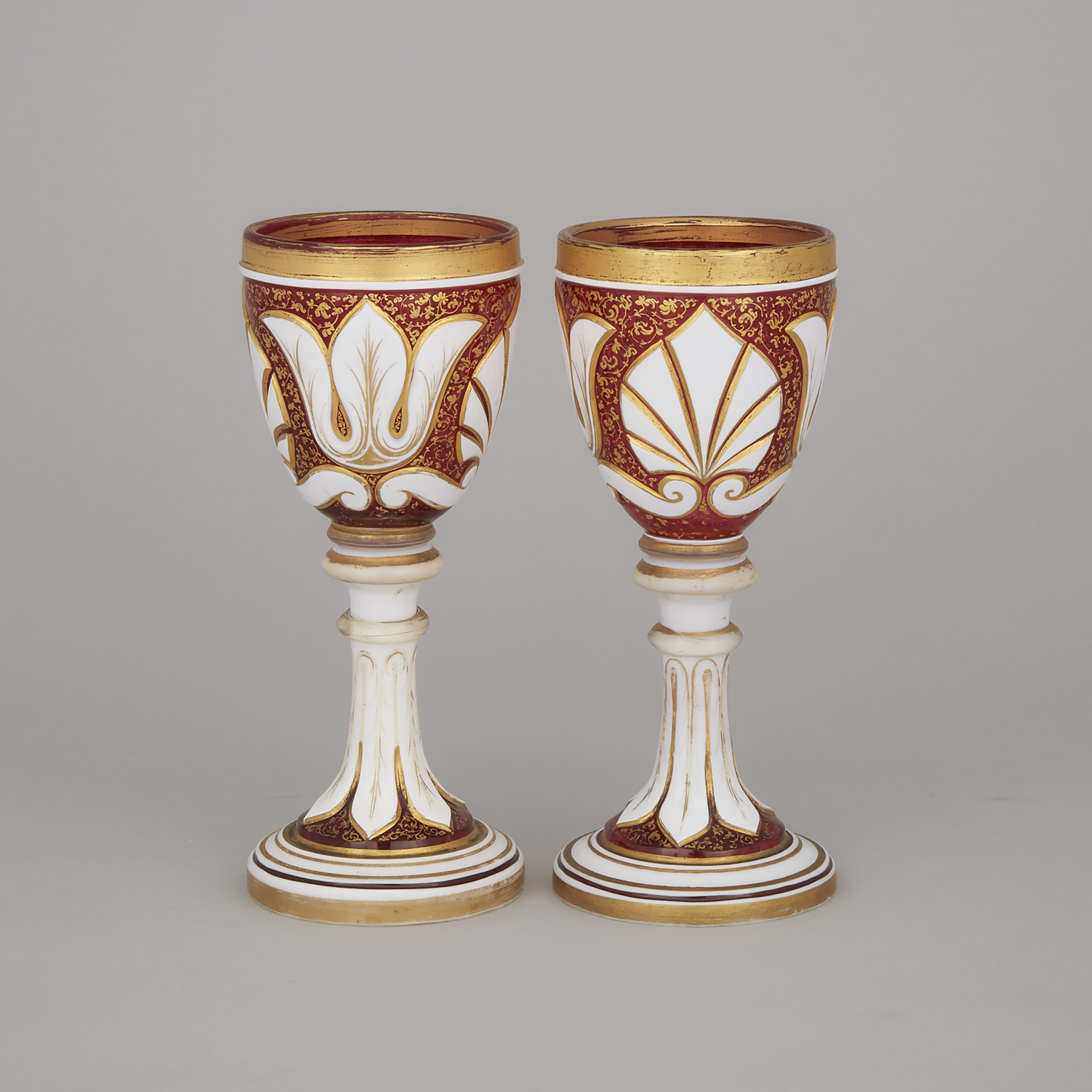 Pair of Bohemian Overlaid, Cut and Gilt Red Glass Goblets, late 19th century