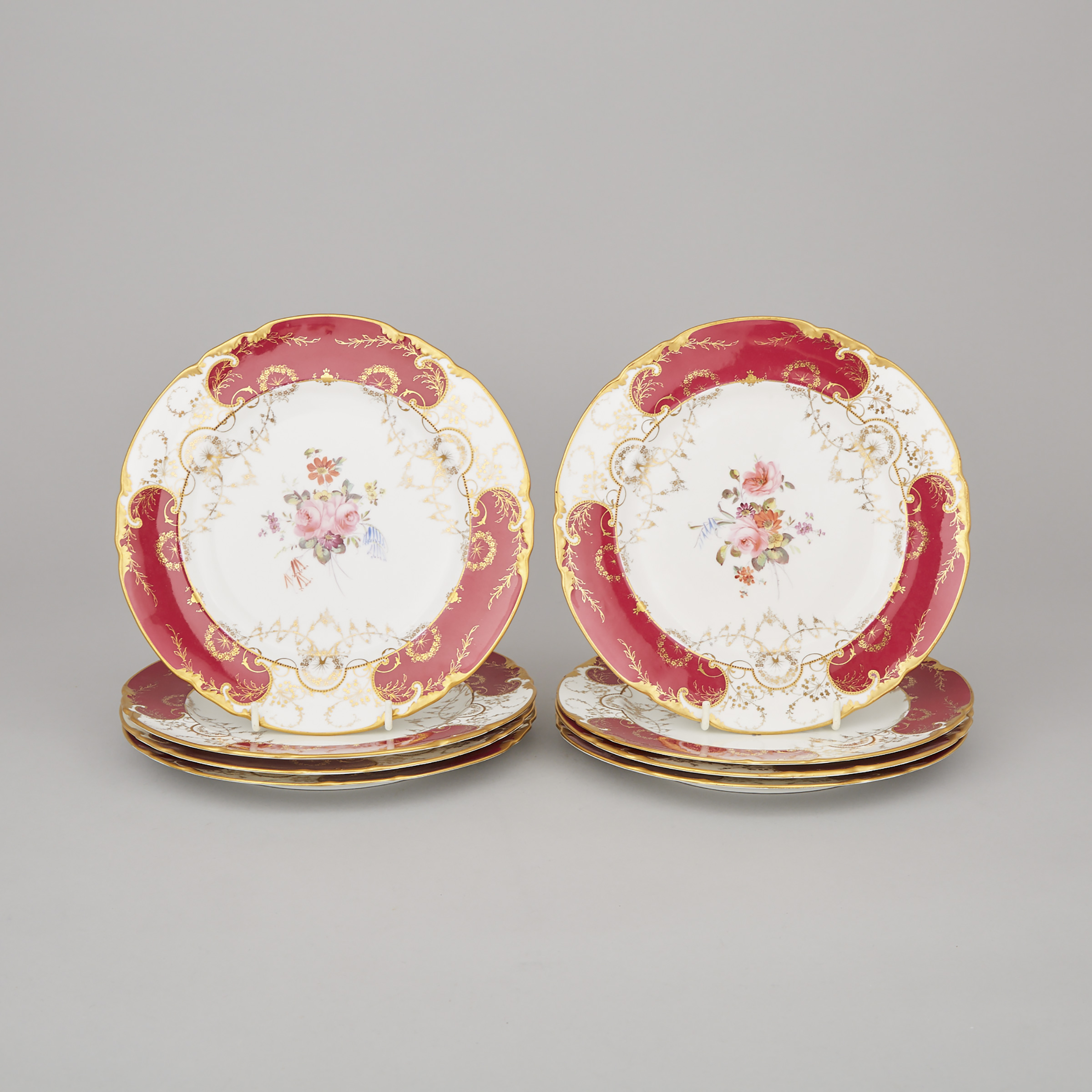 Eight Royal Crown Derby Floral Decorated Claret and Gilt Ground Plates, c.1928-30