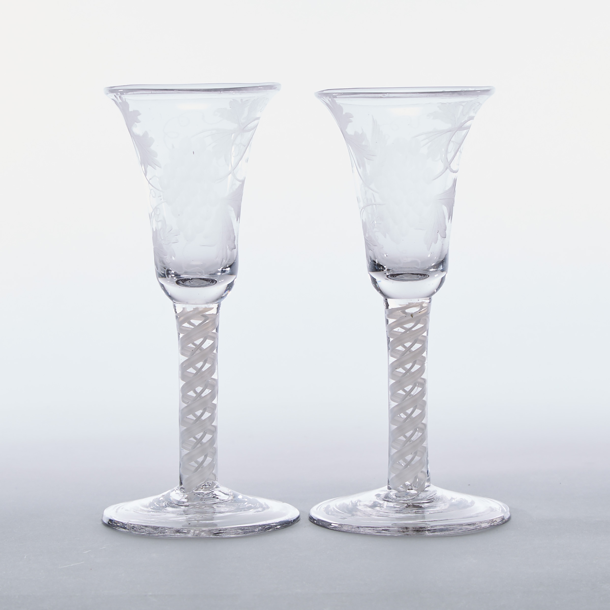 Pair of Continental Engraved Opaque Twist Stemmed Wine Glasses, late 18th/19th century